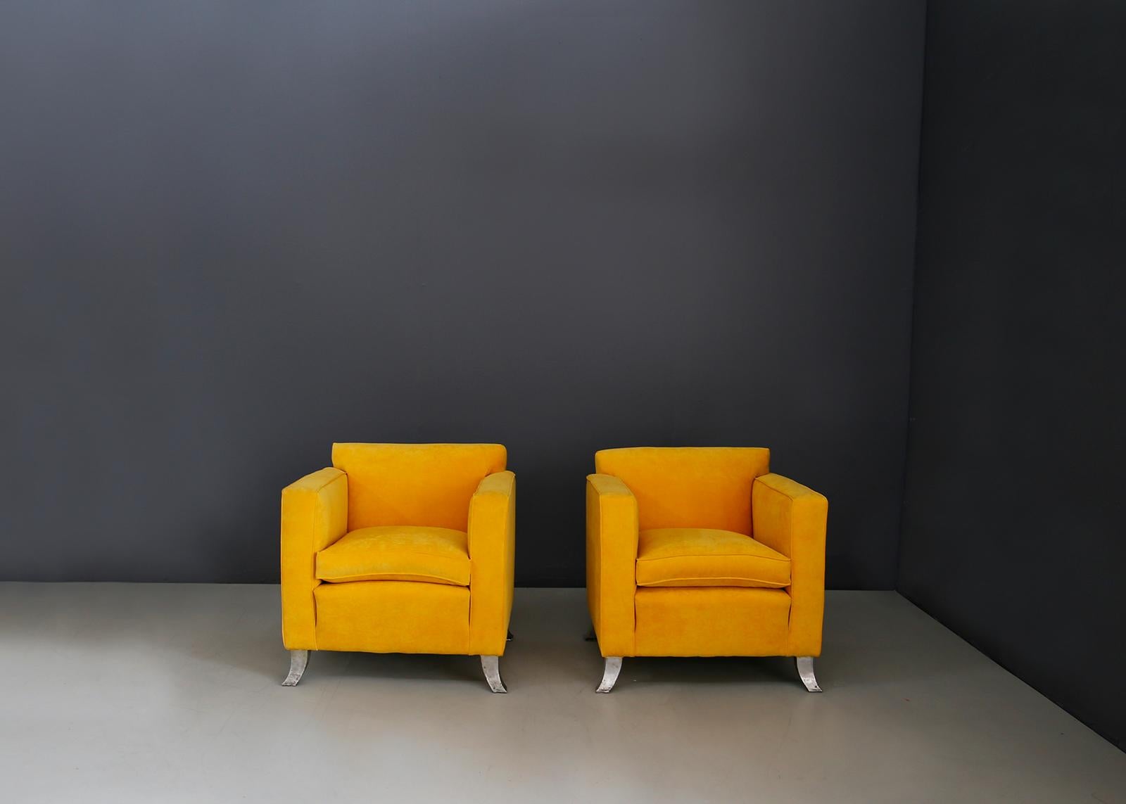 Beautiful pair of armchairs by Melchiorre Bega from 1938-1940. The pair of armchairs has been restored in yellow velvet of the highest quality. Some similar models have been published in various design catalogues and state archives. The pair of