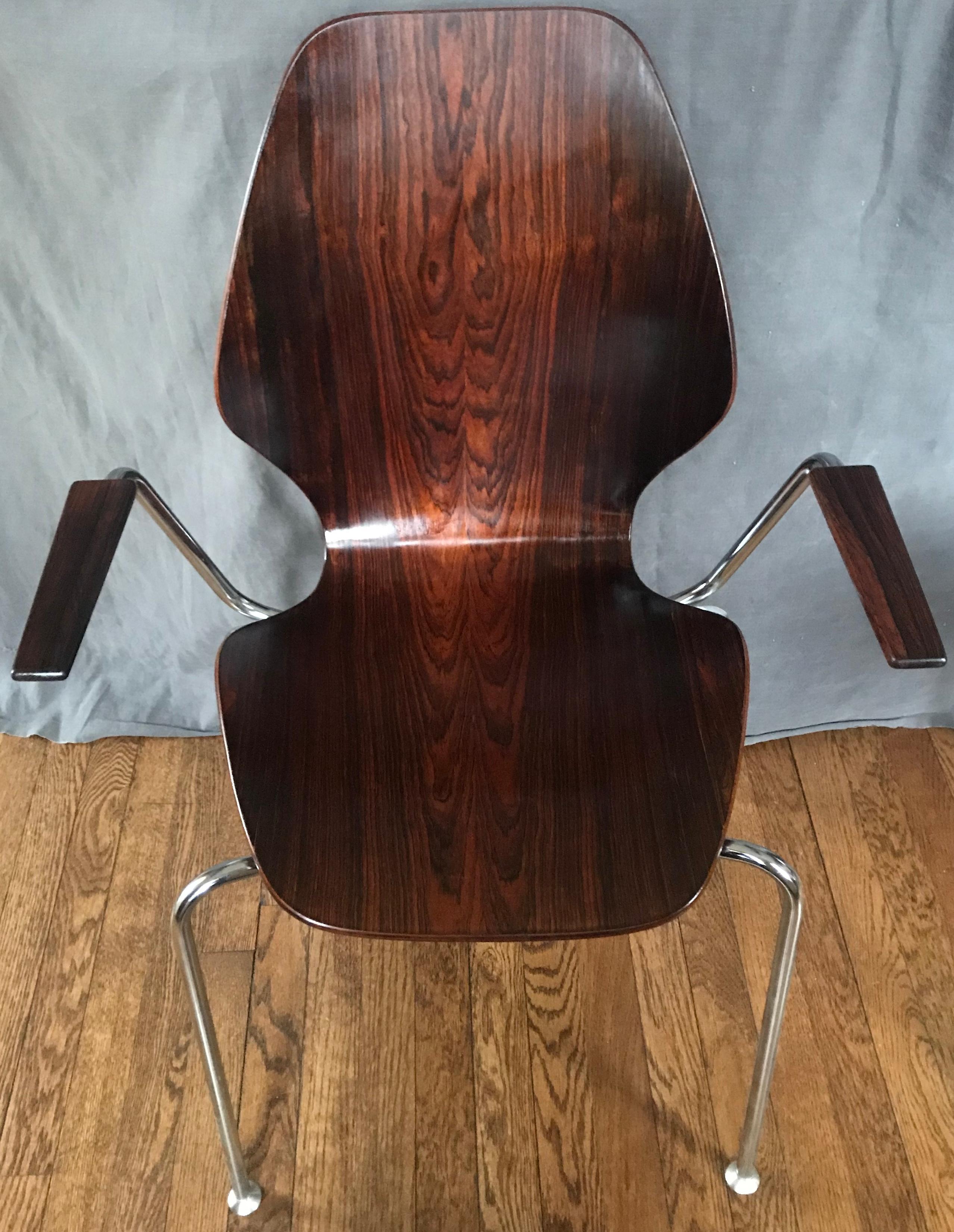 Mid-century Danish rosewood chair. Danish armchair in chrome and rosewood in mint vintage condition. Denmark, circa 1960's 
Dimensions: 23