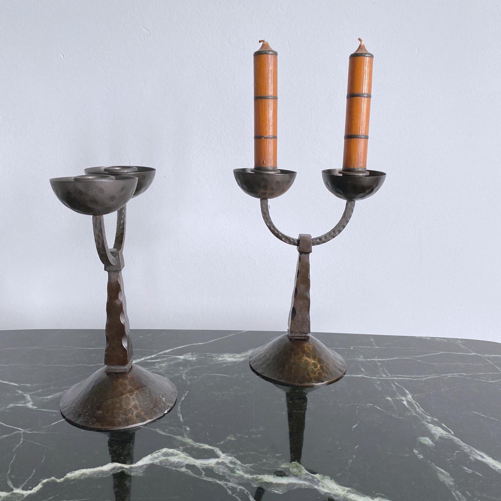 Beautiful midcentury candelabras with two arms each in Arts & Crafts style from 1950s, Austria. Will perfectly fit to rustical furniture by designers like Charlotte Perriand, Pierre Jeanneret, Jean Royère etc. Handmade of forged wrought iron. Very