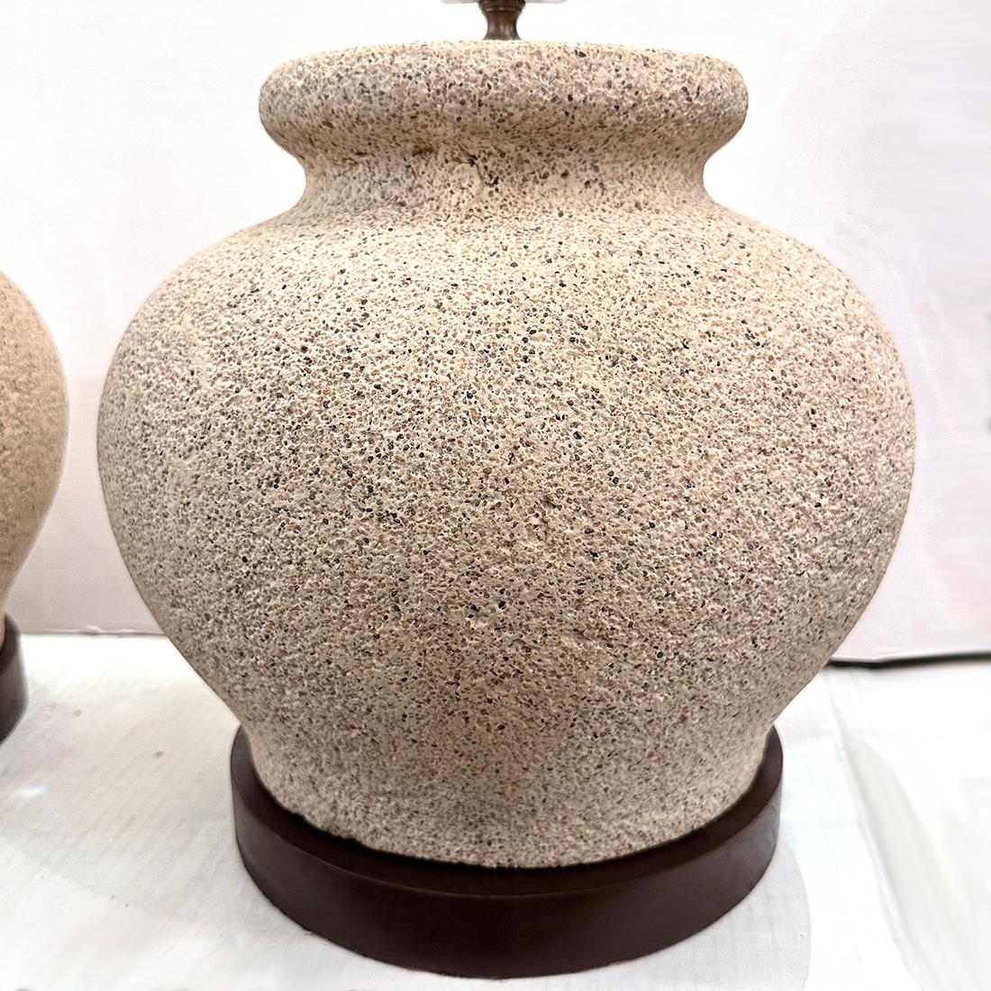 Pair of circa 1970's Italian stone lamps with wooden bases.

Measurements:
Height of body: 15
