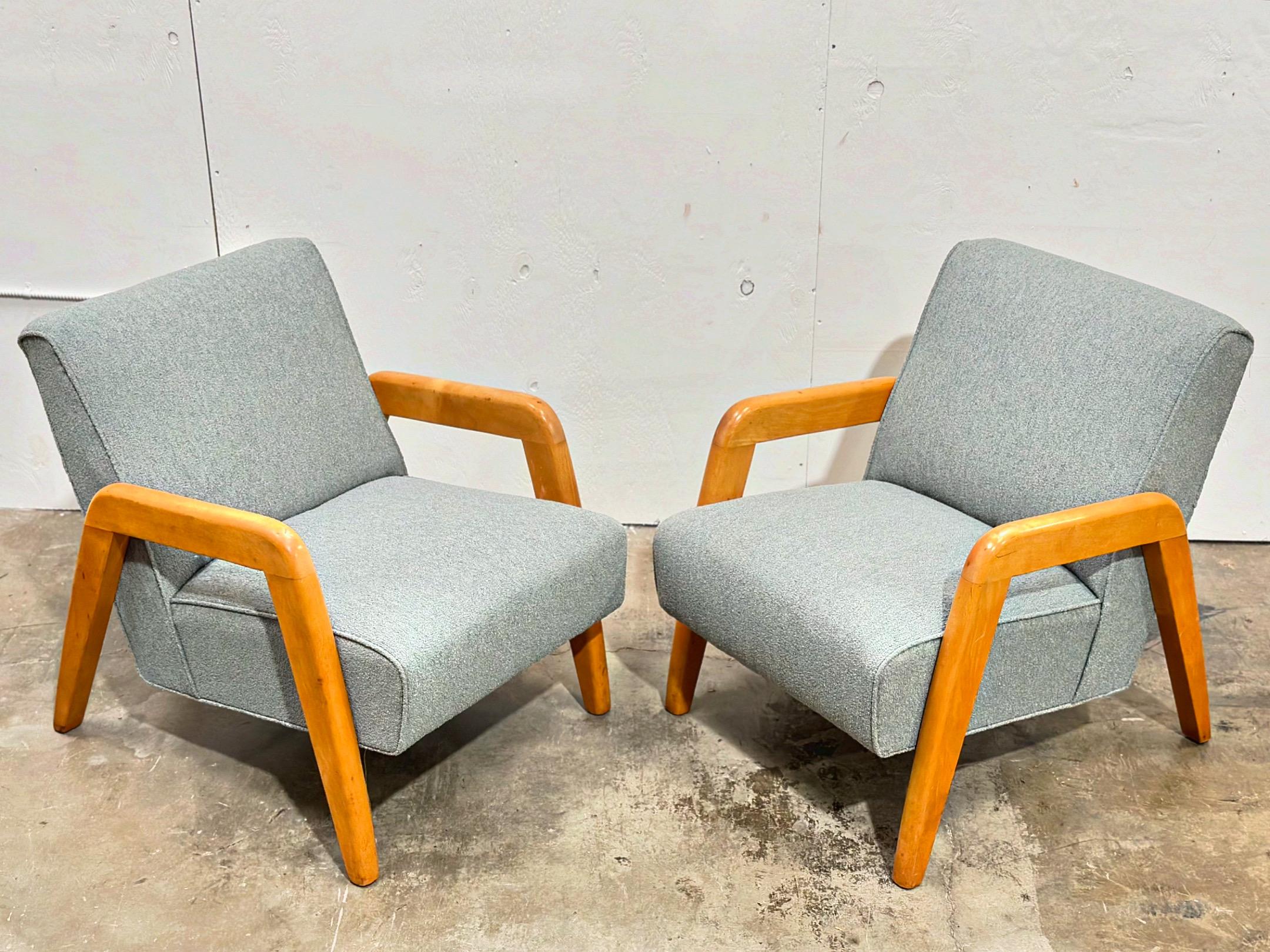 Pair of mid century modern lounge chairs designed by Russel Wright and produced by Thonet circa late 1950s. 
Excellent overall condition. New sea foam green performance boucle upholstery. Solid maple wood frames have been cleaned and conditioned -