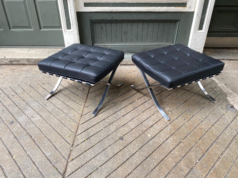 Pair Mies van der Rohe stainless steel Barcelona ottomans. New leather straps and cushions! Stainless steel is in very nice condition! Stainless steel models are especially desirable because they were always more expensive than the chrome models