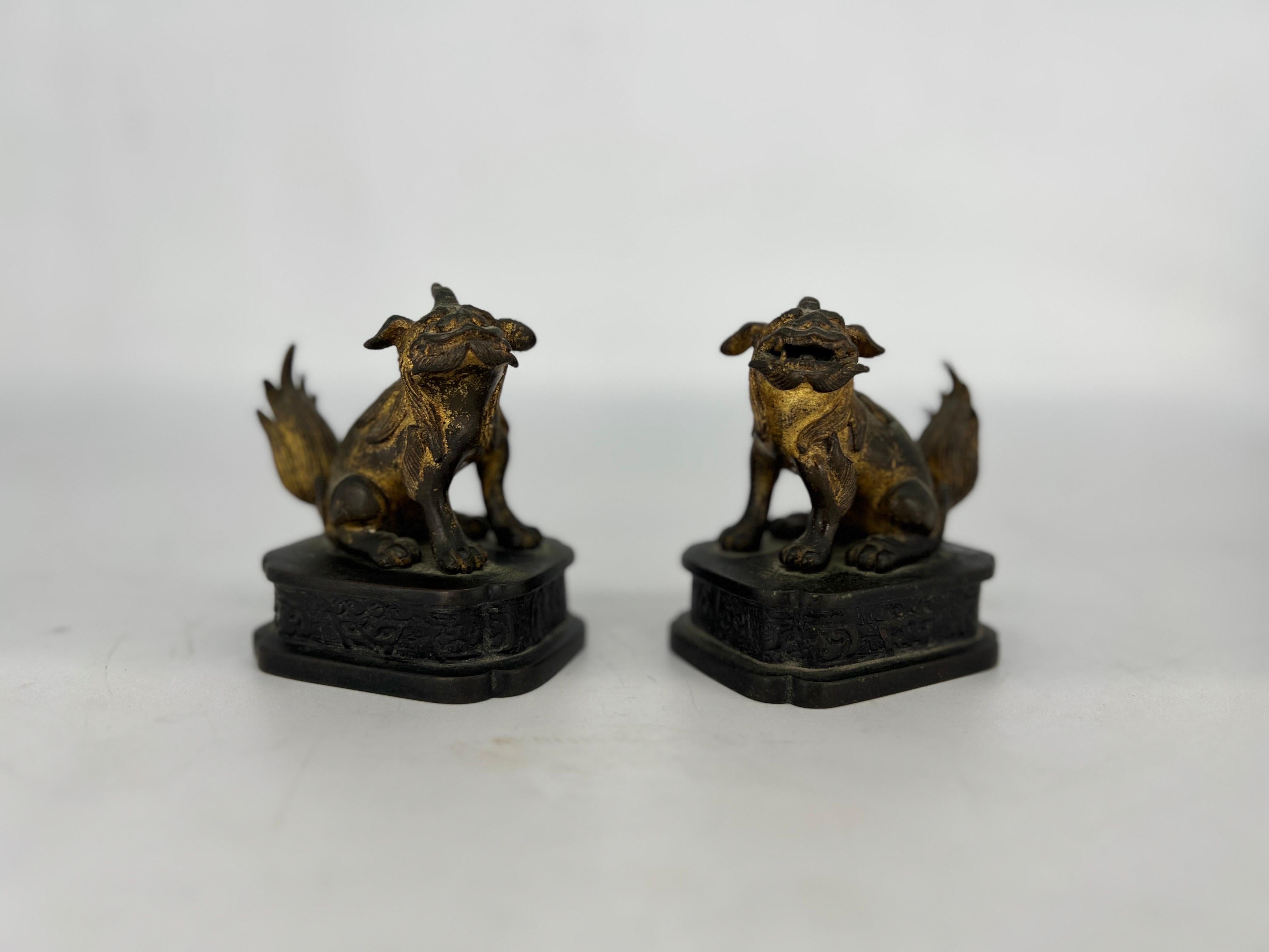Chinese, Ming Dynasty. 
Pair, Ming Dynasty Gilt Bronze Diminutive Chinese Foo Dogs or Guardian Lions of extraordinary quality and casting. Procured from an important New York Collection. 

