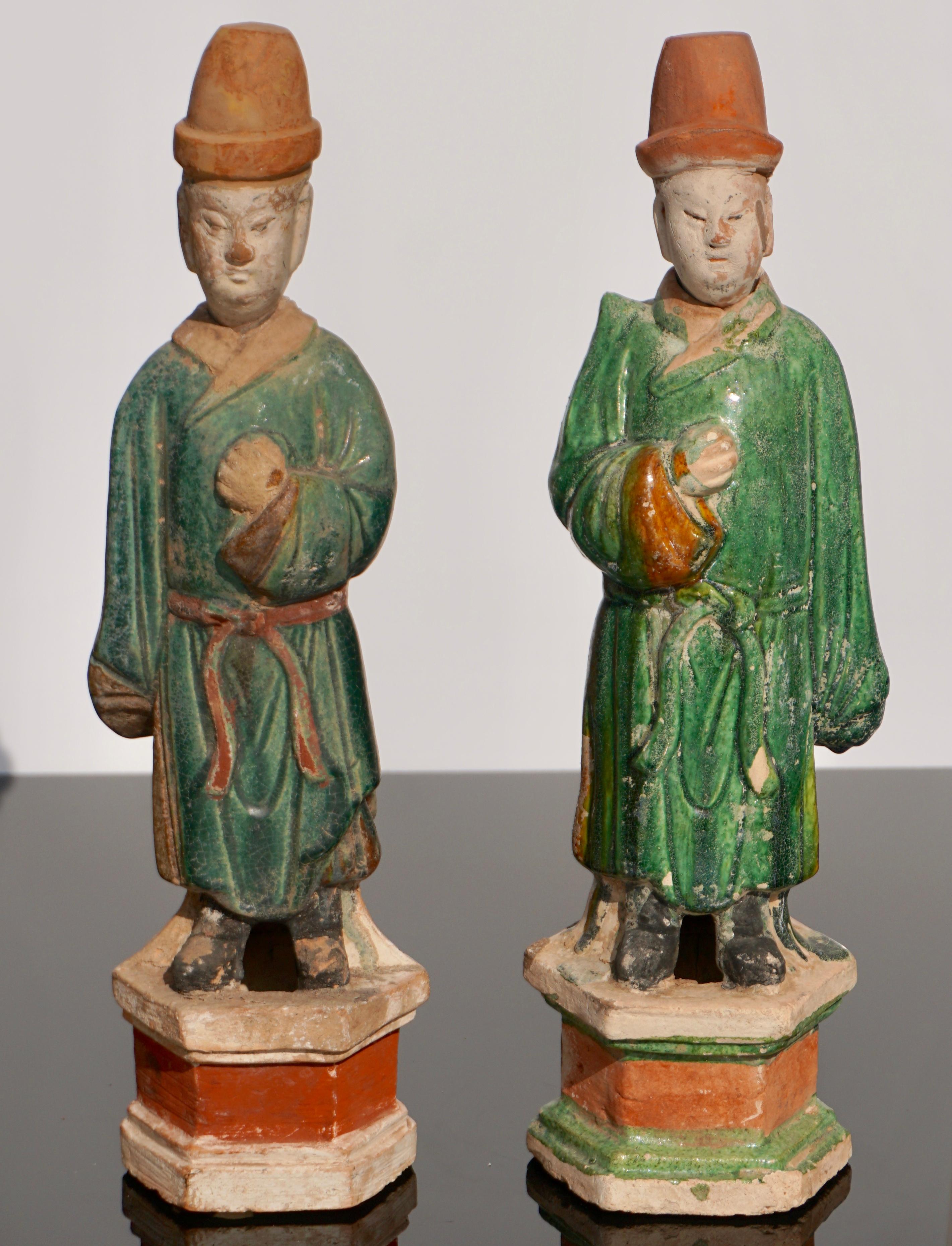 A wonderful pair of Sancai glazed terracotta tomb attendee figures. These colors of green and cream add depth and class to any decor and are very charming as an extra bonus. Ming Dynasty (1368-1644 AD)

Height: 16.25 inches (42 cm)
Diameter: 4.75