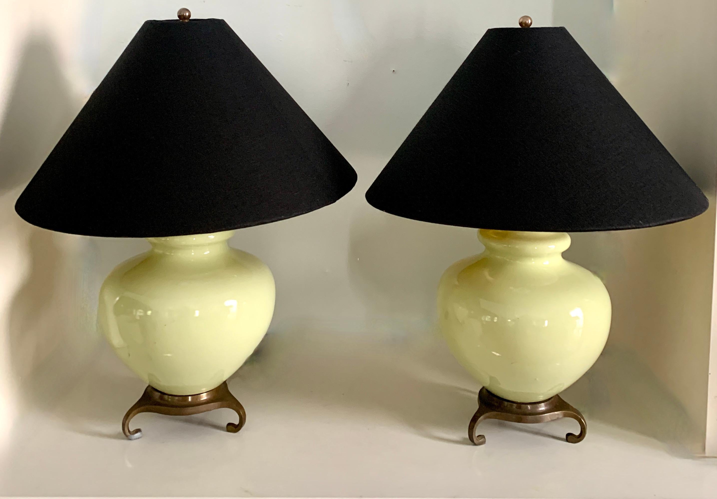 A pair of very light mint green lamps with Asian style Brass bases. The lamps have new custom linen shades with gold foil interiors. A compliment to many interiors - the size and style work well in a living or bedroom and the foil interiors creates