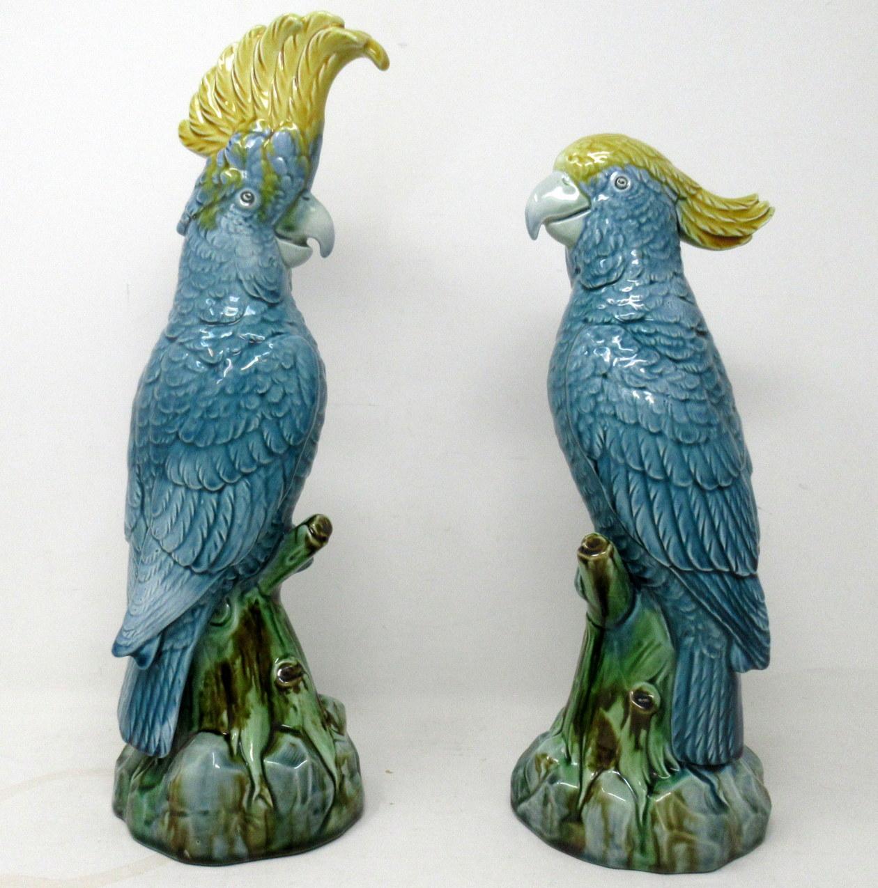 An exceptionally fine quality highly detailed pair of English pottery vivid Majolica Parrot Feathered Figures, firmly attributed to Mintons, last quarter of the Nineteenth Century. 

Each with exquisite colourful glaze in colours of Kingfisher