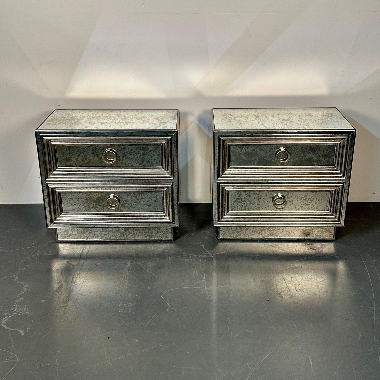 Pair Mirrored Hollywood Regency Nightstands, end tables, side tables, distressed
A stunning pair of two drawer antiqued mirror night or bedside stands. Each fine custom quality table having silver giltwood cases with two drawers having matching