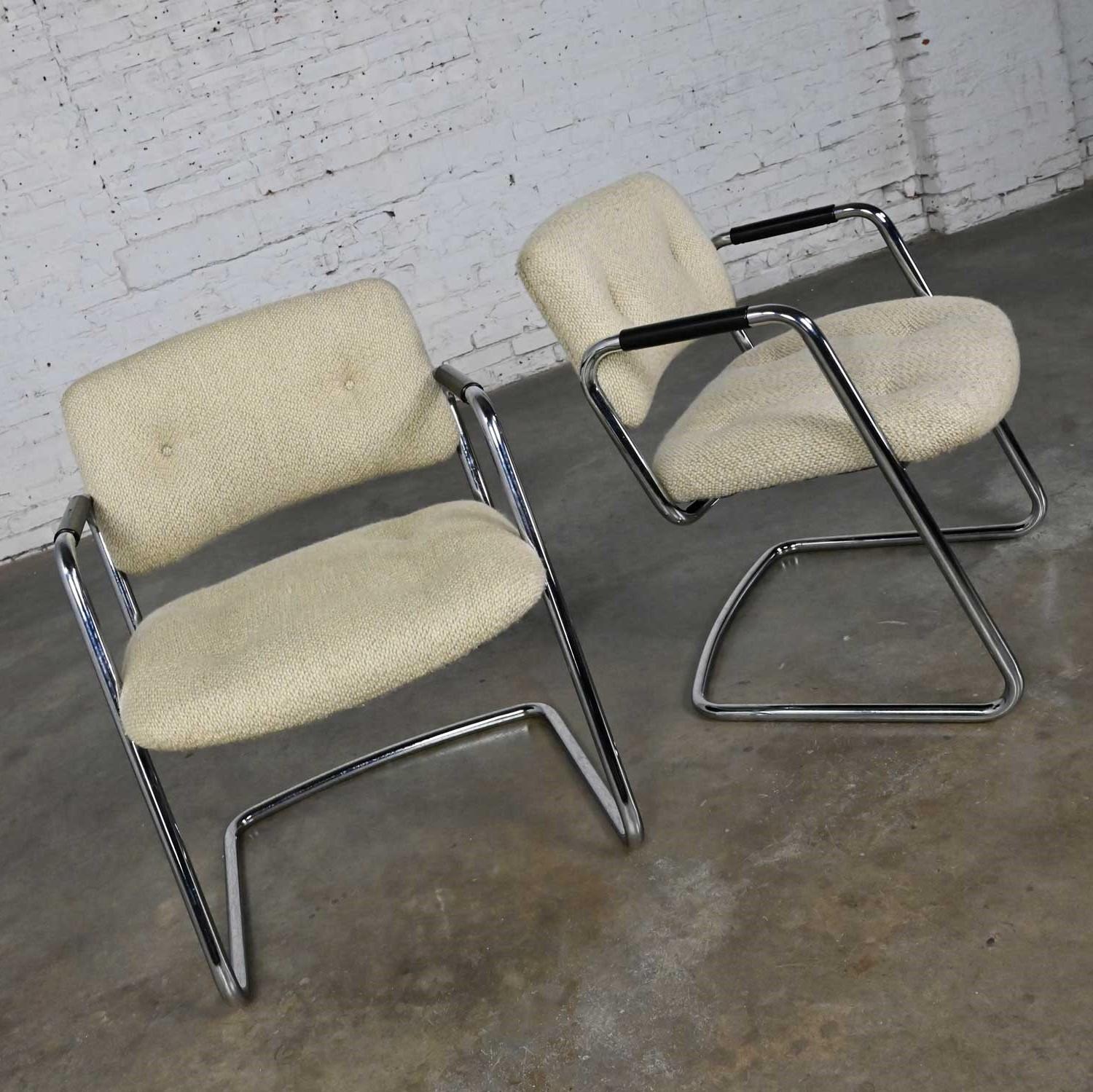 Fabulous vintage pair of modern chrome cantilever chairs with original oatmeal hopsacking and black plastic armrests by Steelcase labeled Model #421-482. Beautiful condition, keeping in mind that these are vintage and not new so will have signs of