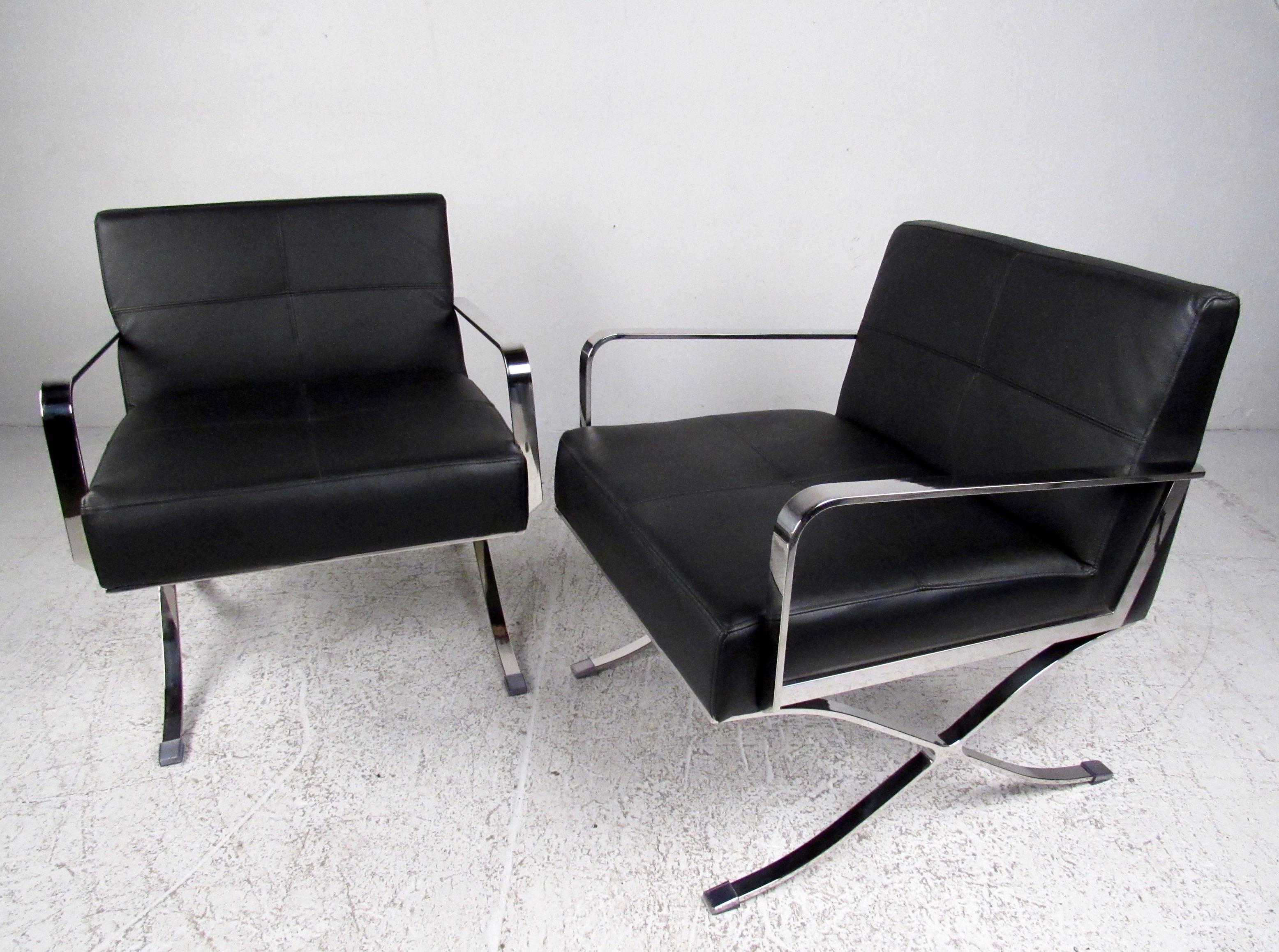Midcentury style and elegant simplicity make this matched pair of contemporary modern armchairs a striking addition to home or business seating. Features heavy flat-bar chrome chairs with stylish X-style base. Please confirm item location (NY or NJ).