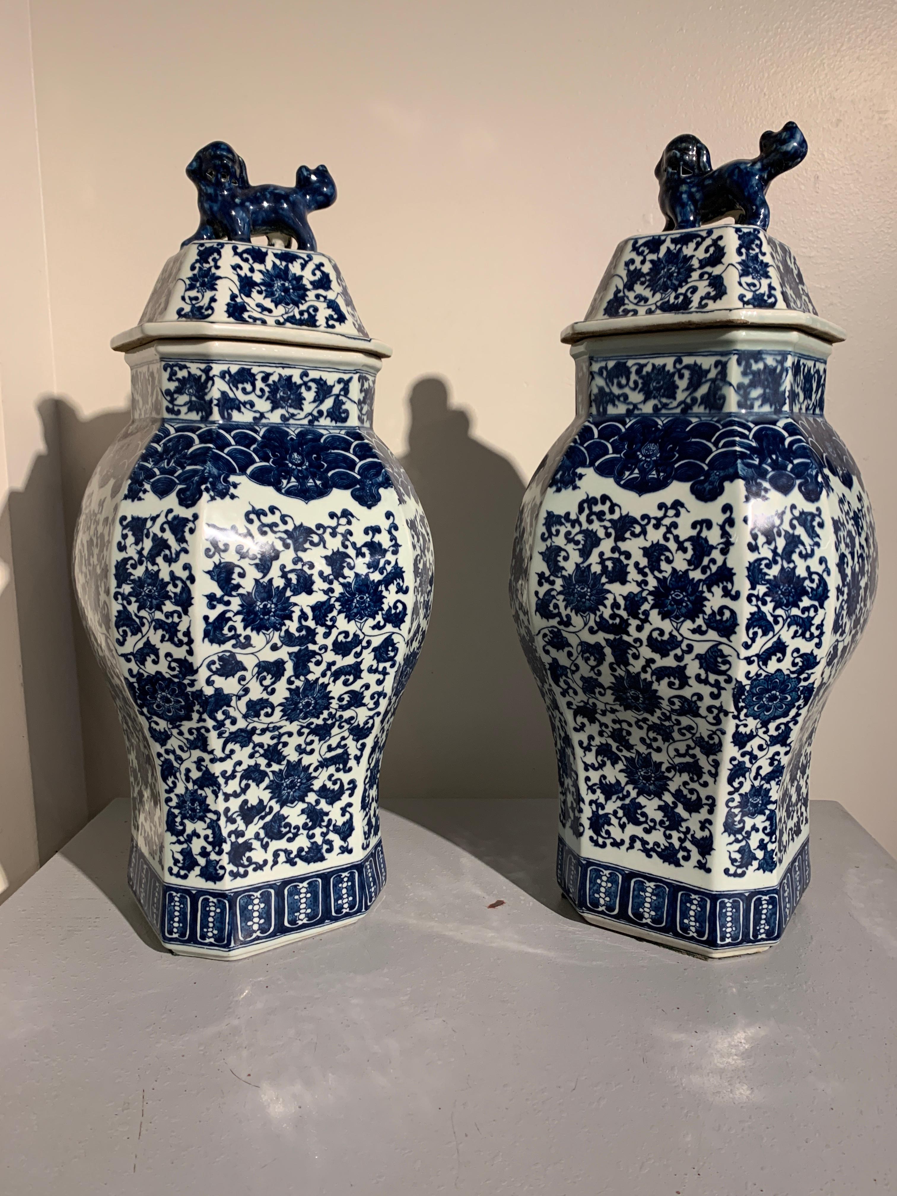 A large and attractive pair of Chinese blue and white octagonal jars and covers, modern, early 2000s, China. 

The large and tall pair of vases or jars of square shape with faceted corners. The slightly bulging bodies decorated in a dense blue and