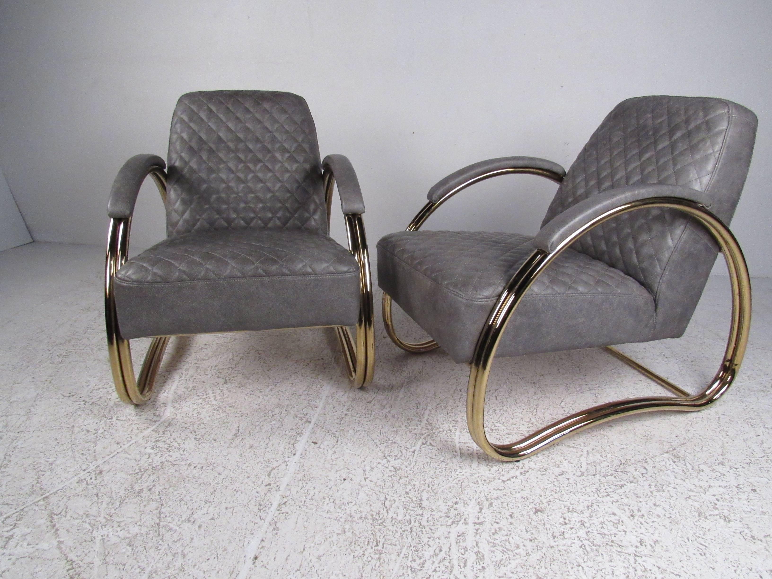 This stylish pair of contemporary modern lounge chairs feature stitched leather upholstery, unique brass finish sculpted frames, and comfortable seating proportions. Elegant midcentury style makes a unique addition to home or business seating areas.