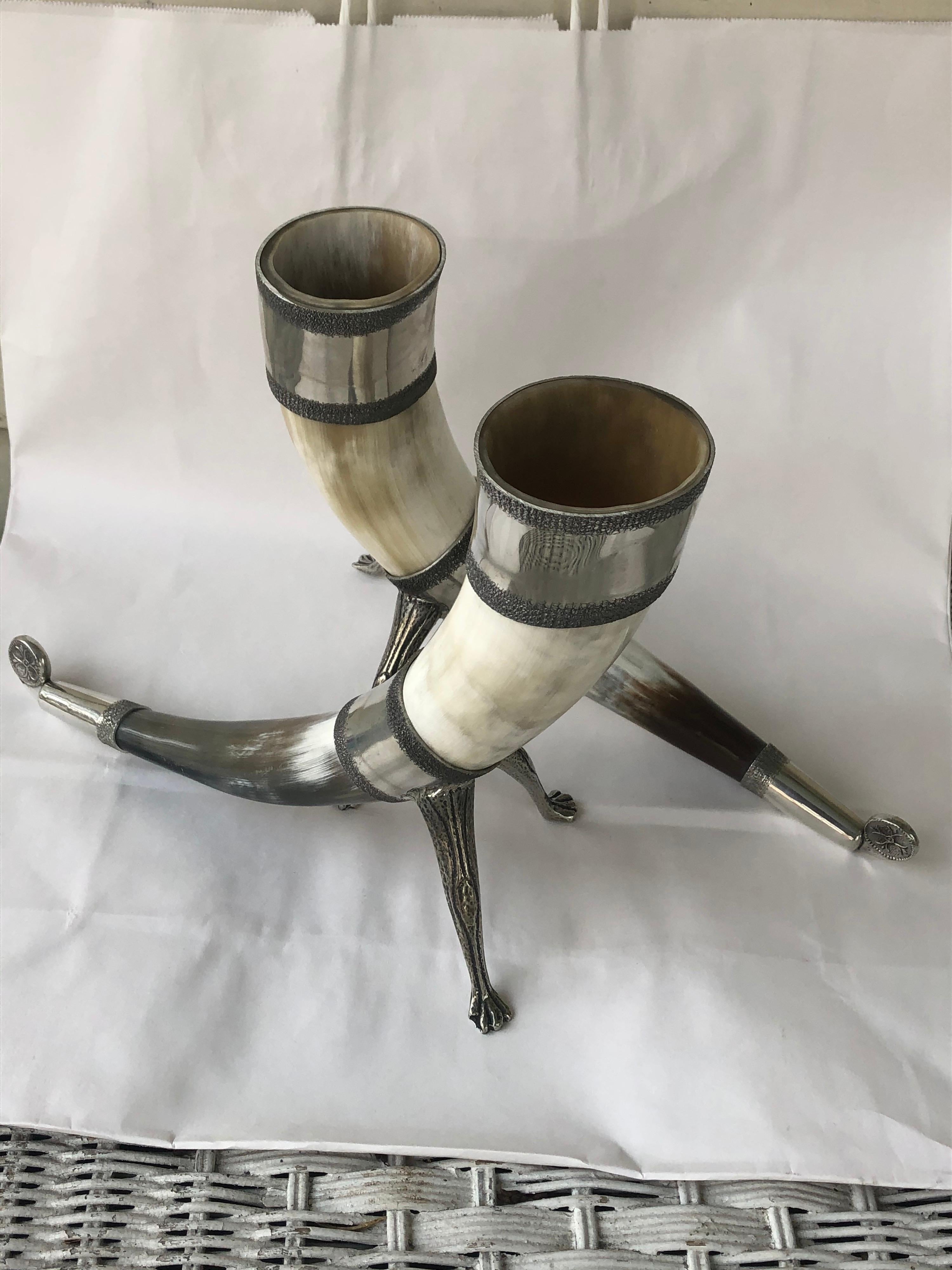 Handsome modern pair of pewter-mounted drinking horns. They hold liquid so
could be used as vases.