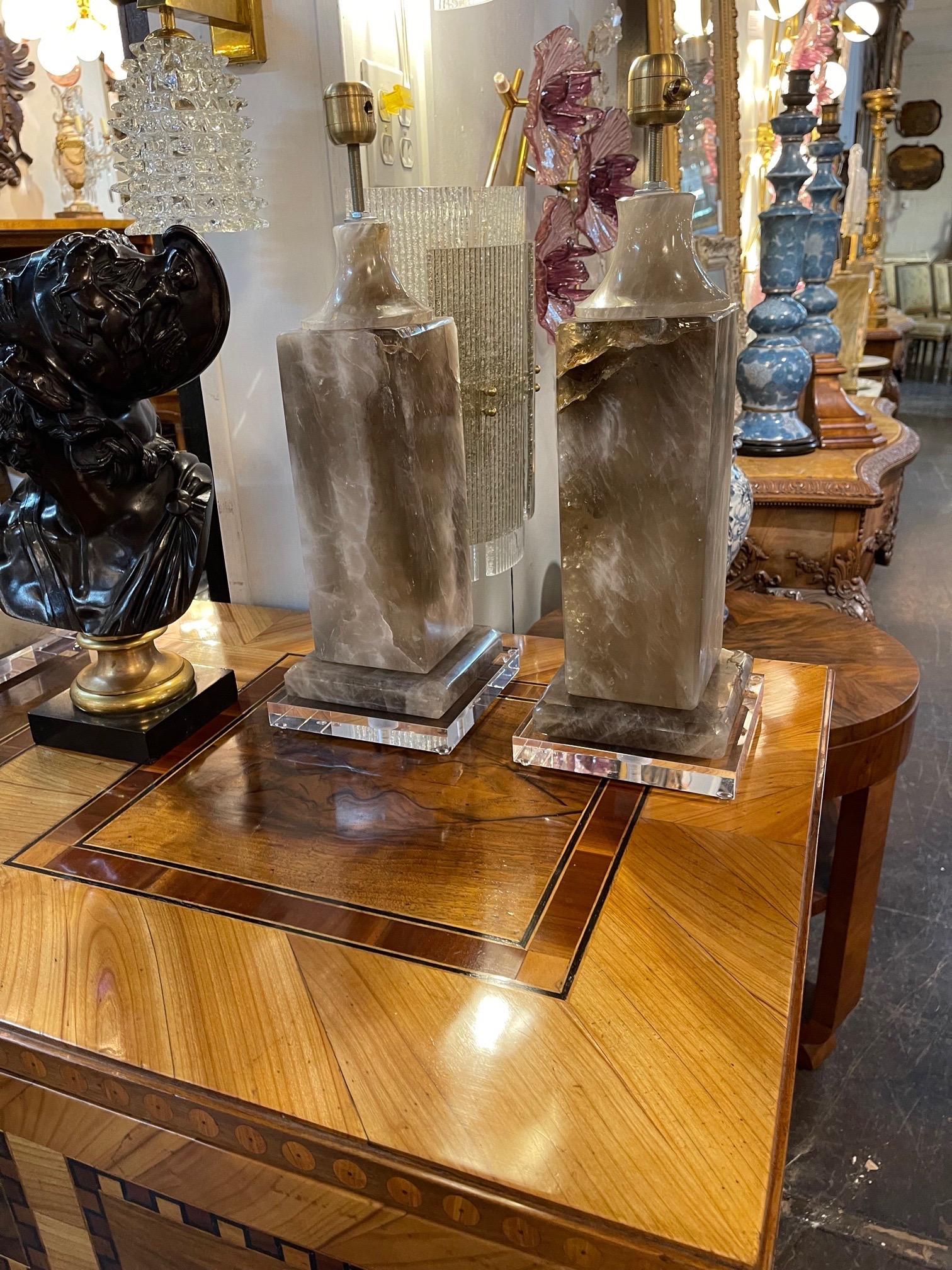 Exceptional pair of modern smoky rock crystal lamps on a lucite base. So much depth and color to these. A real treasure from the earth!