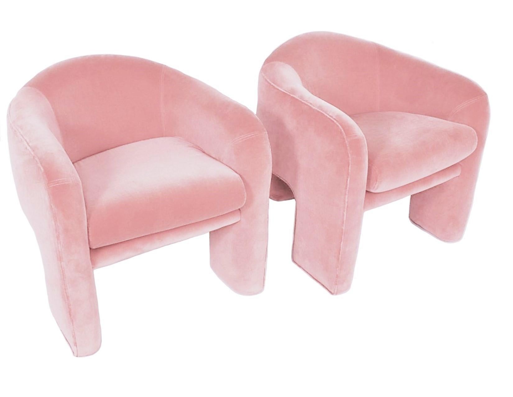 Eye-catching, three-legged sculptural chairs manufactured by Weiman-Preview. Expertly restored, these chairs are compact nicely padded upholstered in a plush pink colored velvet. Very comfortable! Dramatic design these chairs are show-stoppers.