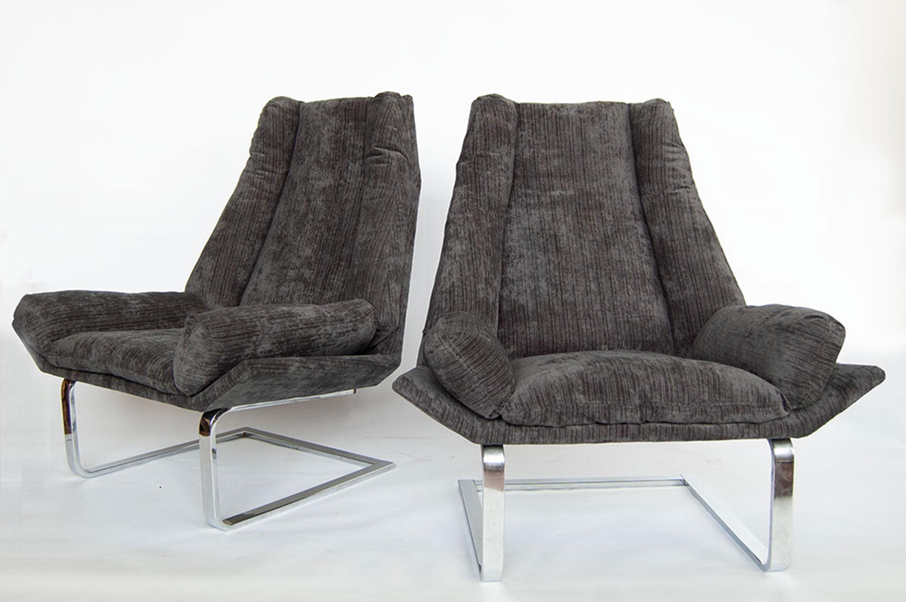 Two are better than one. Exceptional pair of modern wing chairs by Design Institute of America DIA. Newly upholstered in a smoke chenille that gives a nod to gentleman’s suiting. The generous seat is supported by a solid chrome cantilevered base