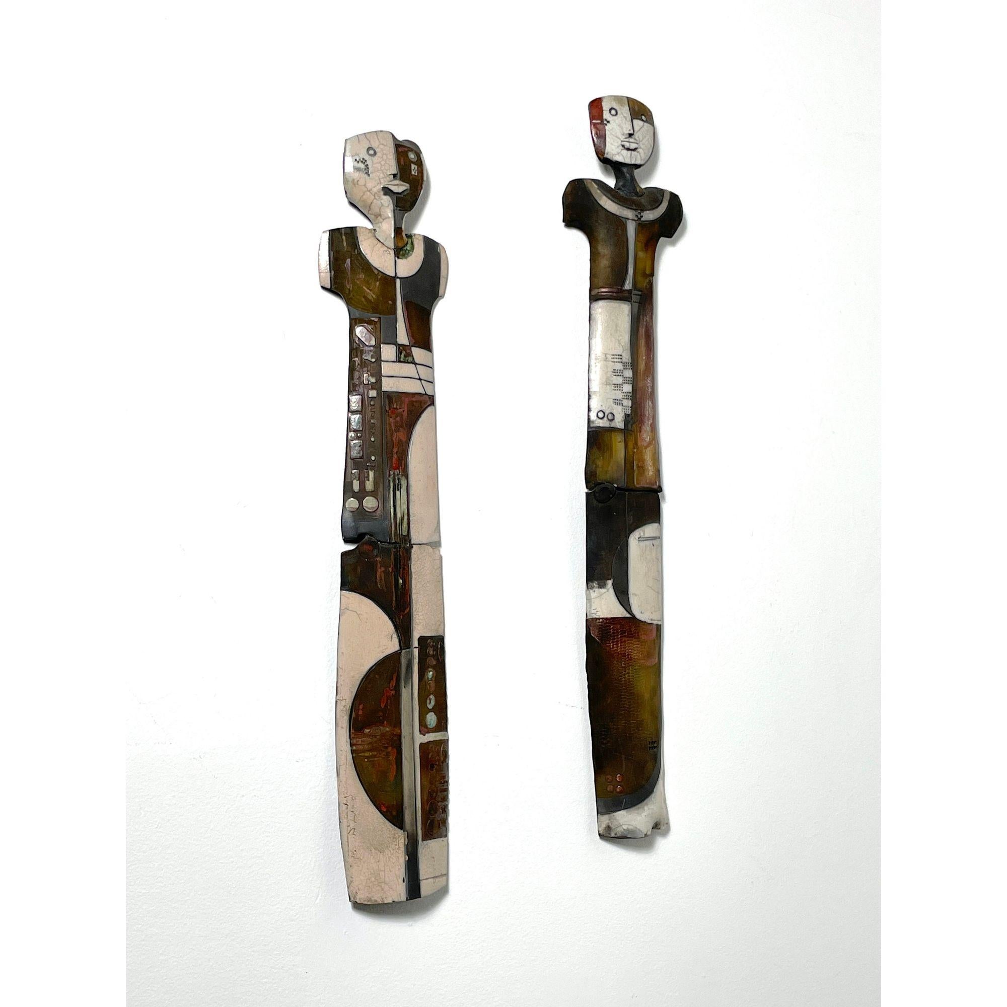 36 in Pair Doug DeLind Modernist Studio Pottery Totem Wall Sculptures 

Michigan artist Doug Delind ceramic totem wall sculptures circa 1970s to 1980s
Tall and narrow cubist figures in various finishes and incised details
Each signed

Additional
