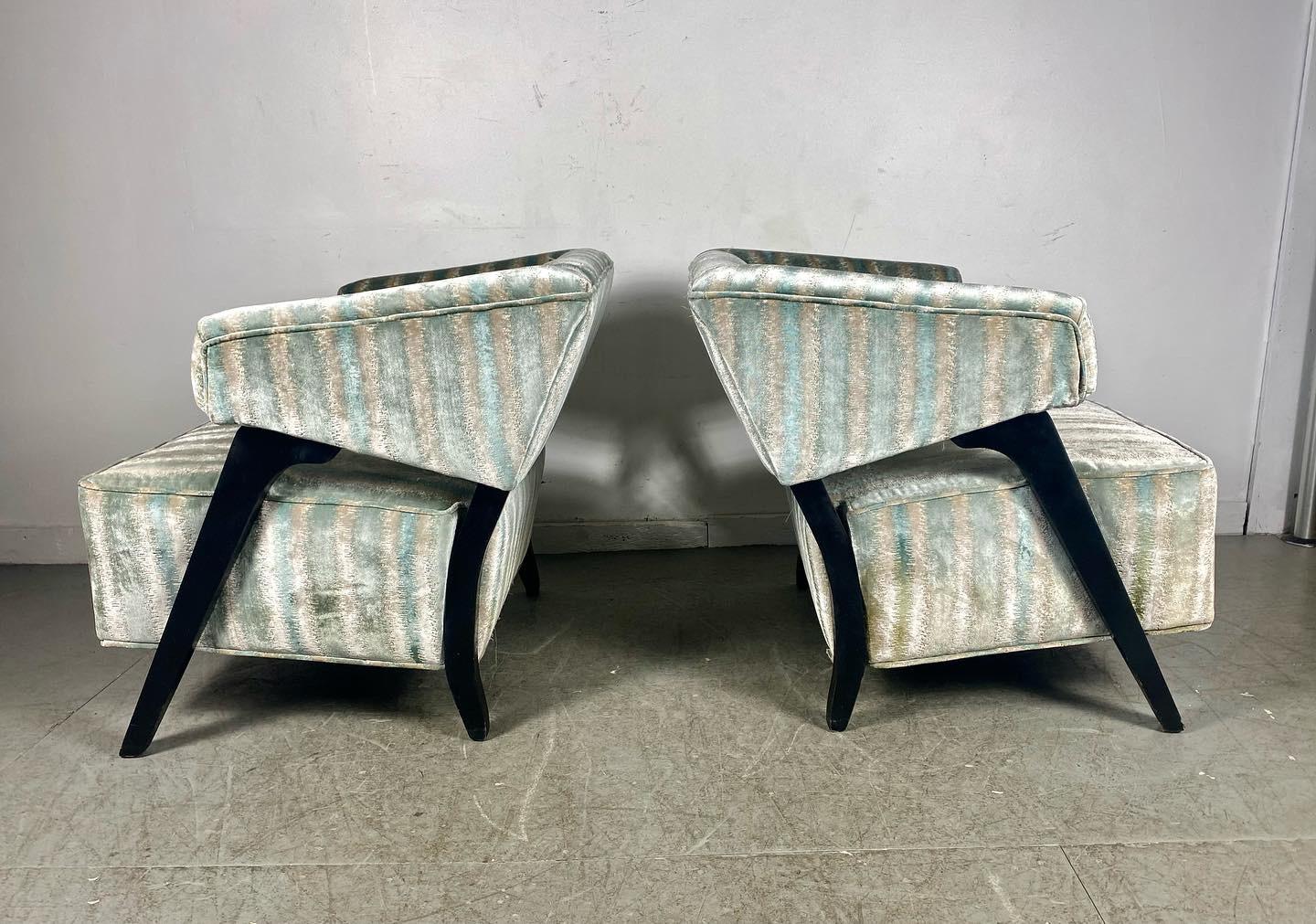 Stunning pair exaggerated Lounge chairs attributed to Karpen of California. Reupholstered approx. 15 years age, high end fabric,, minor wear. Extremely comfortable, Amazing design and style, Hand delivery avail to New York City or anywhere en route