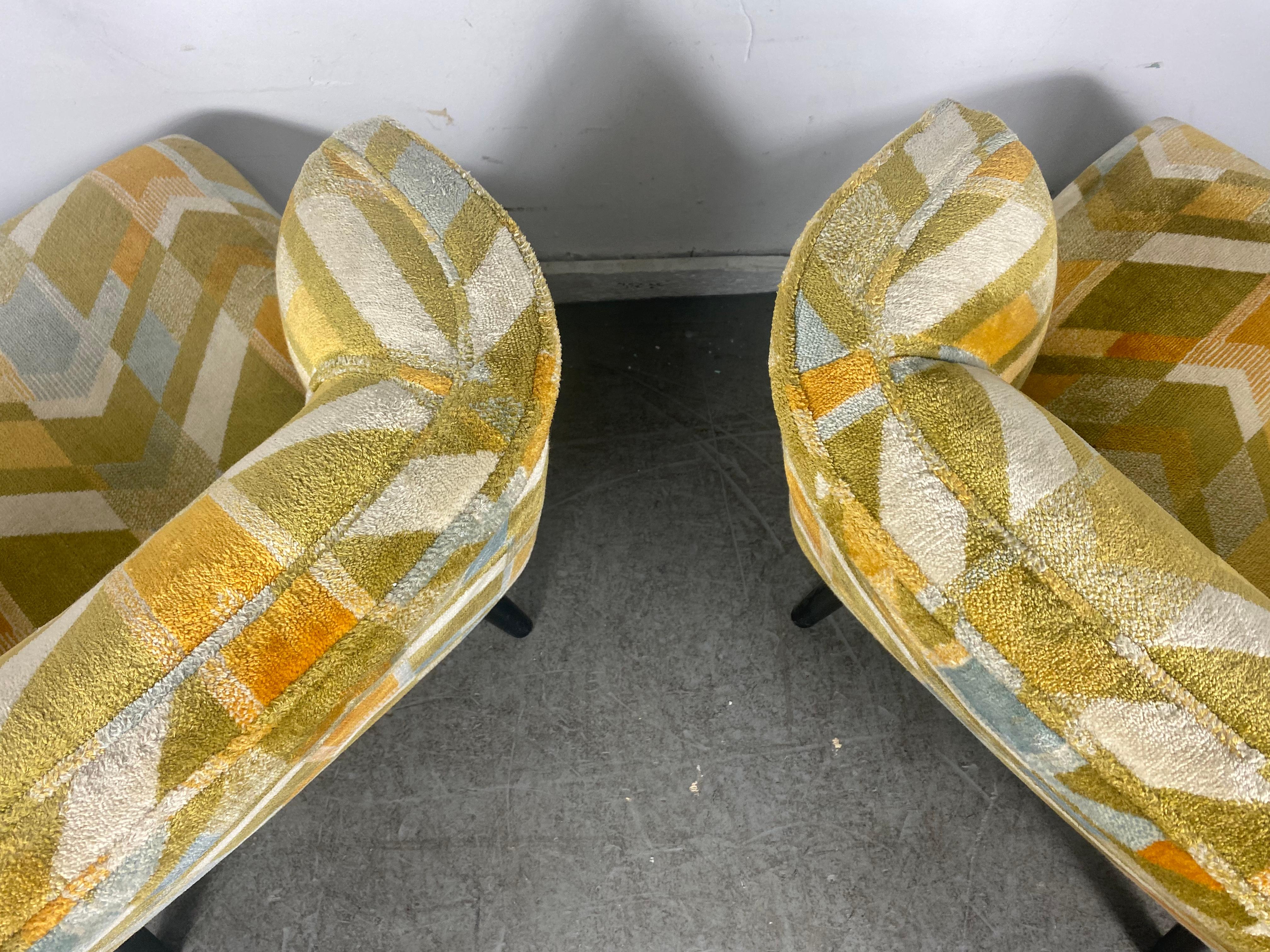 Nice pair slipper / lounge chairs, Classic California Modernist design, appear to have been reupholstered in the 1970s. Stylized geometric fabric, Extremely comfortable. Quality construction. Hand delivery avail to New York City or anywhere en route