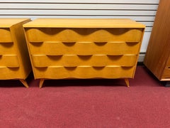 Pair Modernist "wave" front dressers by Edmond J. Spence made in Sweden