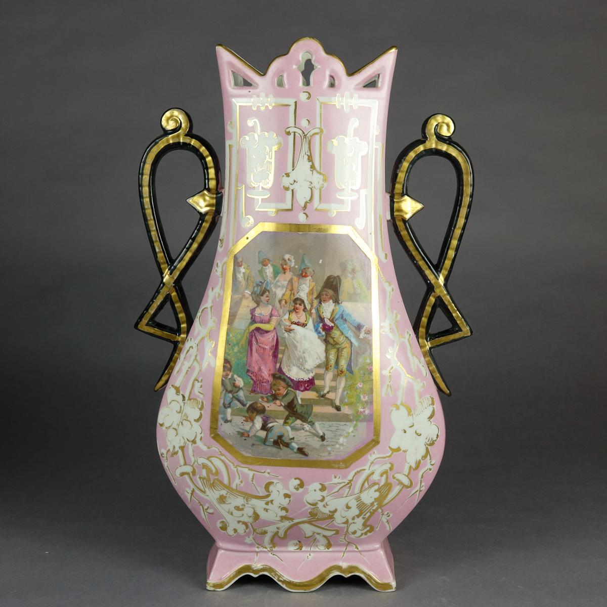 An antique pair of monumental French old Paris pictorial vases offer hourglass form, each with hand painted reserves of genre courting and children scenes flanked by scroll from ebonized handles, surmounted by pieced collar and raised on shaped and