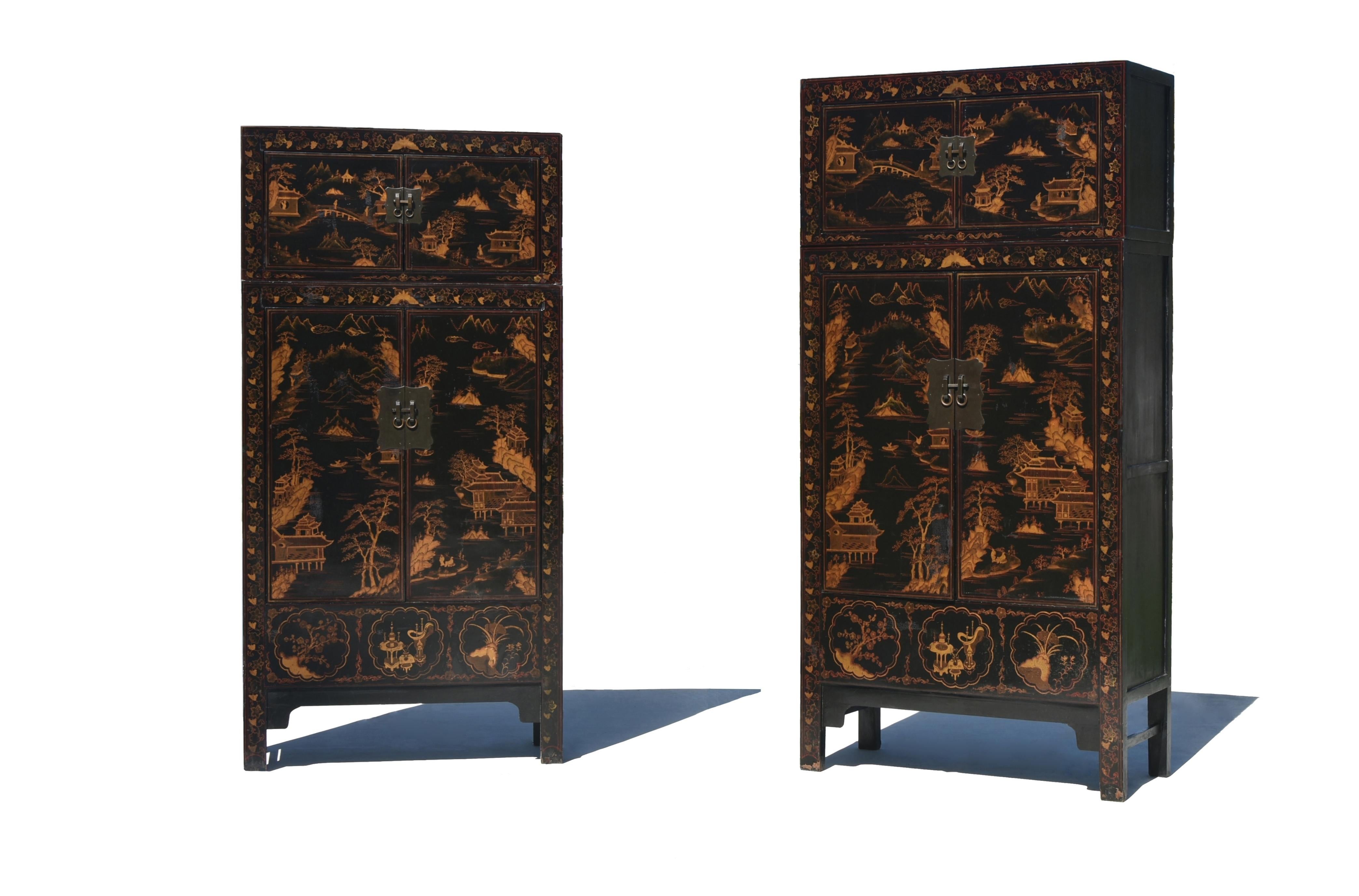 A rare offering. The pair of extraordinary black lacquered Chinese Chinoiserie cabinets with original top chests measuring at 91