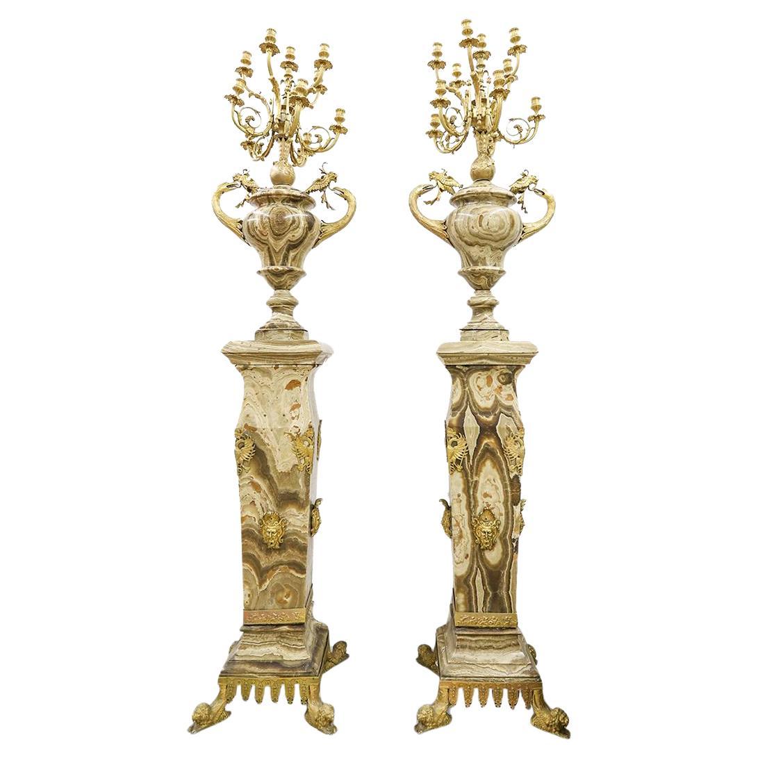 Coppia di torciere monumentali in marmo e bronzo dorato