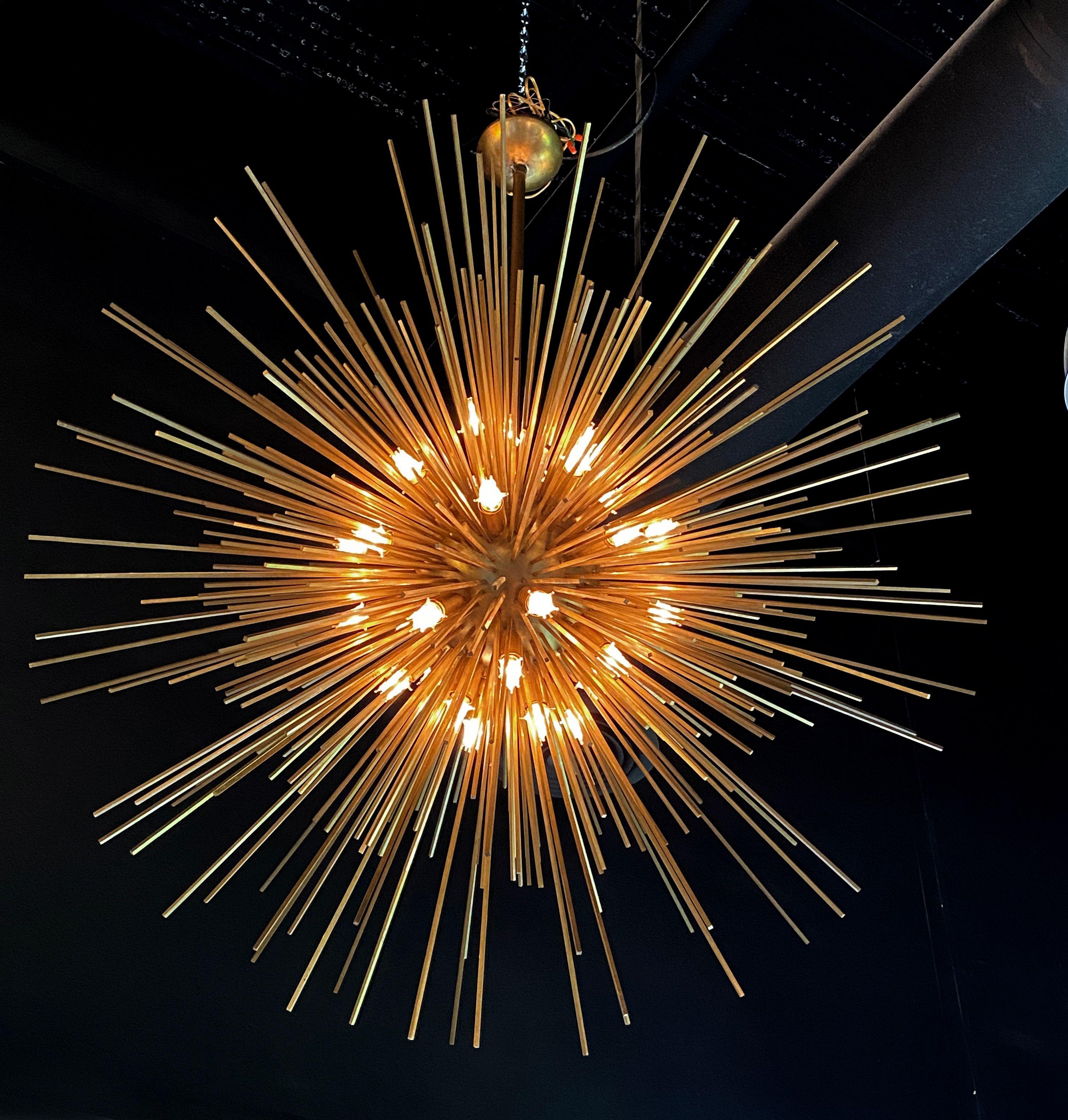 Pair of Italian Modern Monumental Sputnik chandeliers, timeless, modern, glamorous design, long bronze rods in varying sizes radiating from a spherical center with multiple lights around the sphere. 64