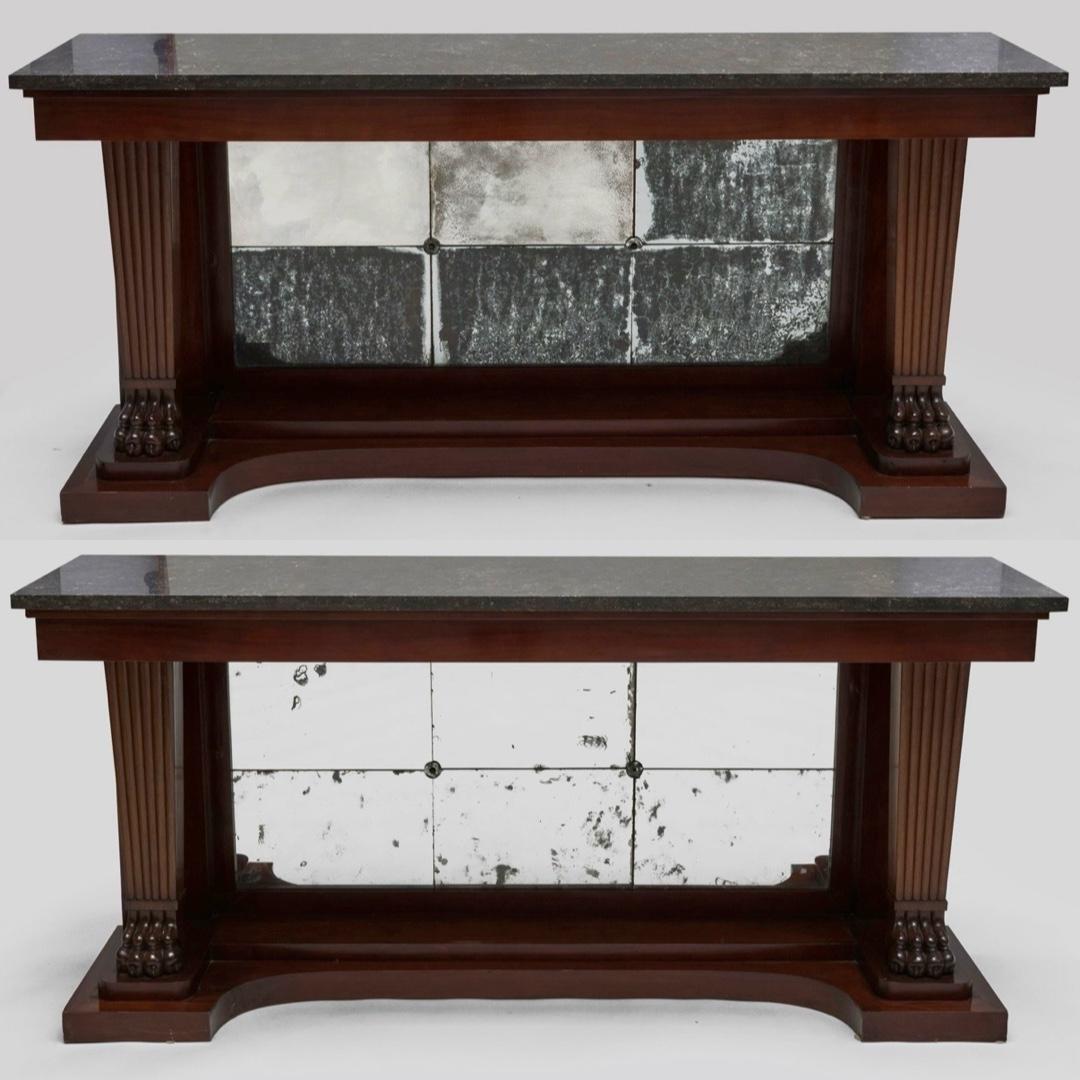 This superb matched pair of Neoclassical or American Empire Style console tables exemplifies the refined neoclassicism after New York's leading cabinetmakers in the early nineteenth century. Styled after the important firm of Duncan Phyfe or a