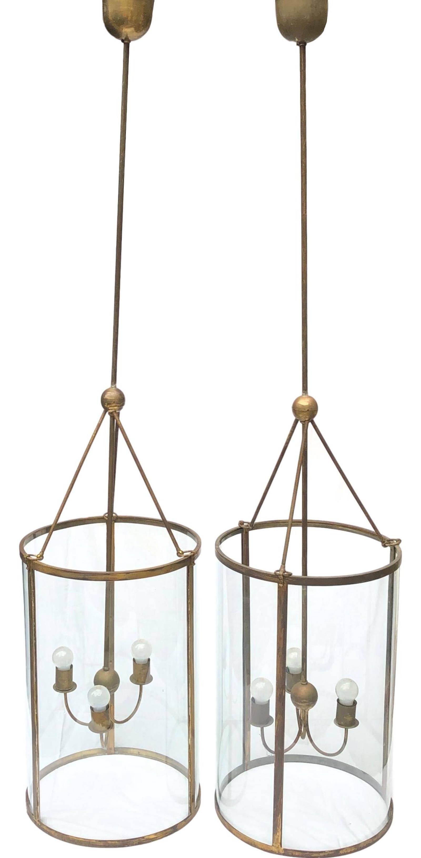 Gorgeous pair of monumental size brass and glass Art Deco chandeliers. Each is in very good condition and requires three European E27 / 110 volt Edison bulbs, each bulb up to 100 watts. The glass is handmade, also the brass frame. The light is wired