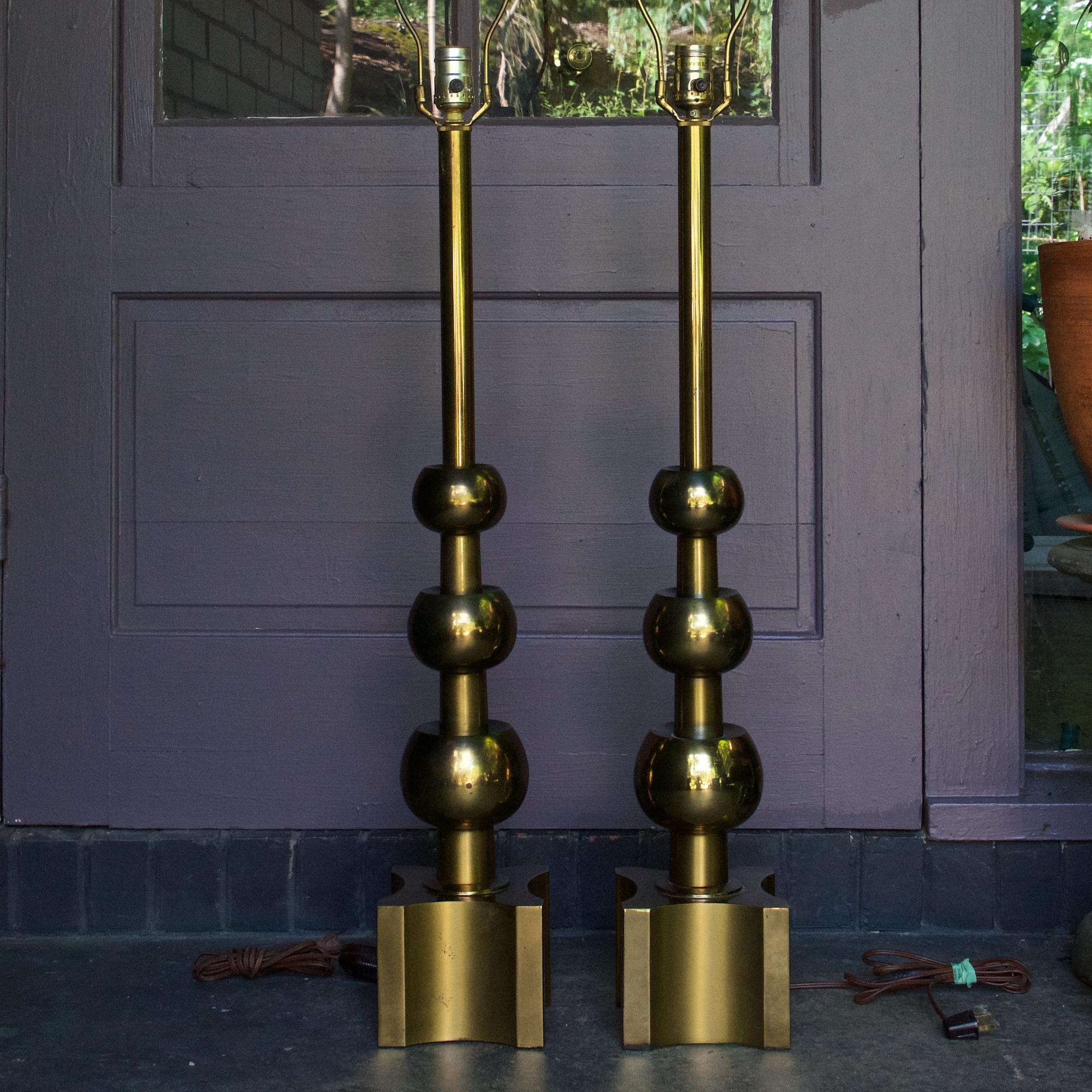 Sale is for a pair.  Heavy patina to all brass surfaces, never polished, one lamp has more atmospheric patina to the brass surface making it a bit darker than its match.  Original harps and finials.  New inner socketry with key shaped switches, see