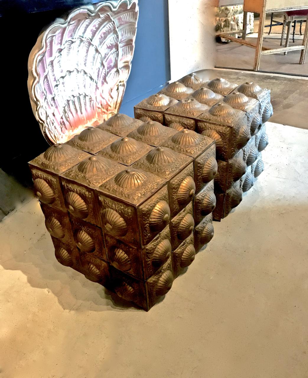 This is a very unique pair of cubes that have been clad in antique Moroccan or Indian tin tiles. The cubes would make a superbly unique coffee table base or bases for side tables once glass was added to the tops. They are also unique pieces of