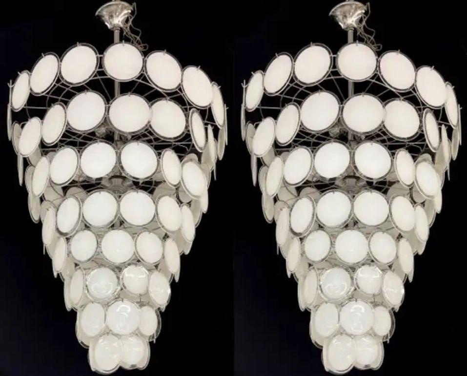 Palatial Murano Disc Mid-Century Modern Tiered Chandeliers, A Pair, Antiqued Brass Base, New Wired, These come in a multiple of colors. 
 
After purchasing a small factory of circa 1950-1960s Murano Discs in Italy we have started to manufacture