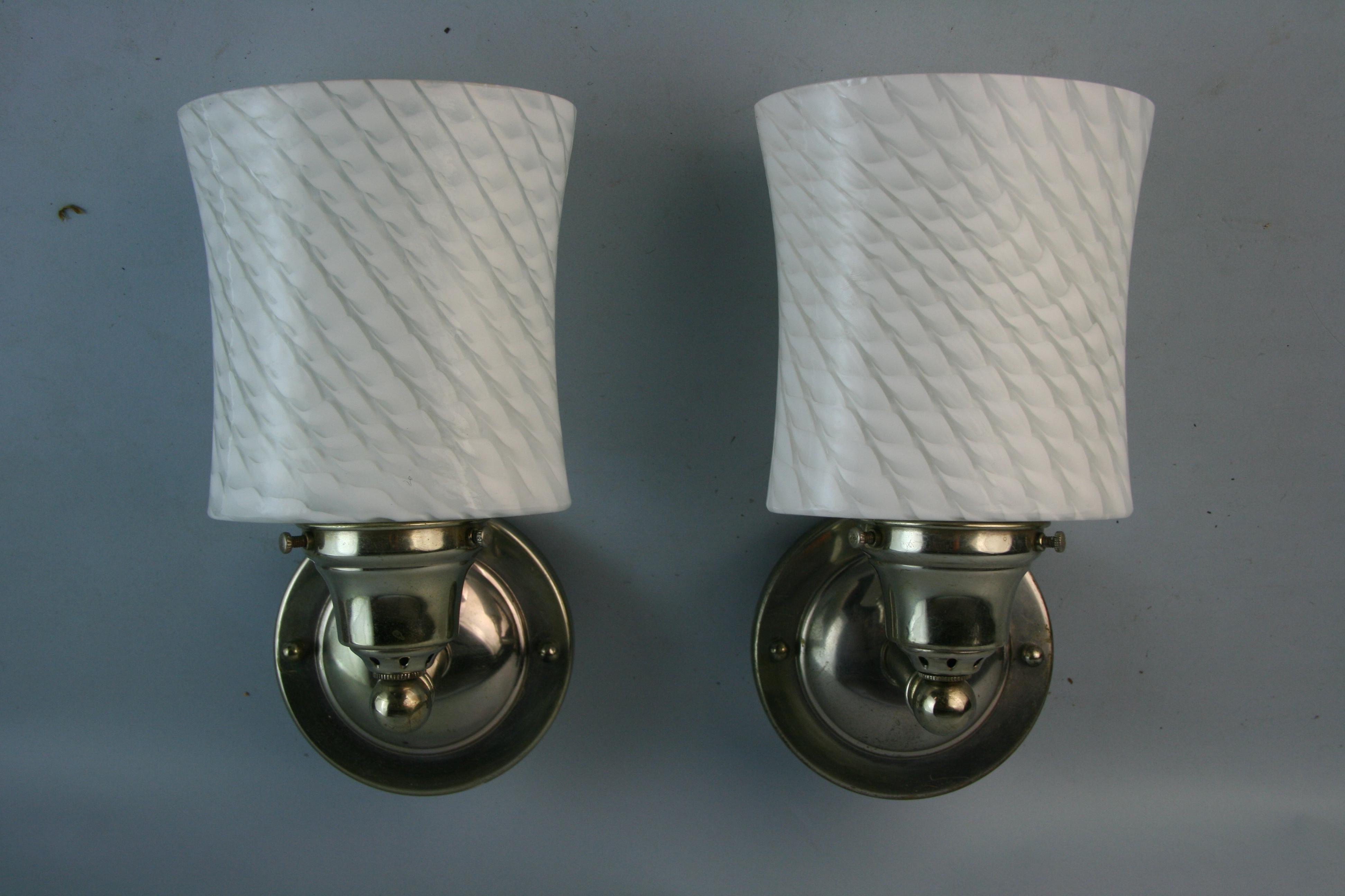 Pair Murano patterned glass sconces with nickeled brass arms and backplate
Takes one Edison 60 watt bulb