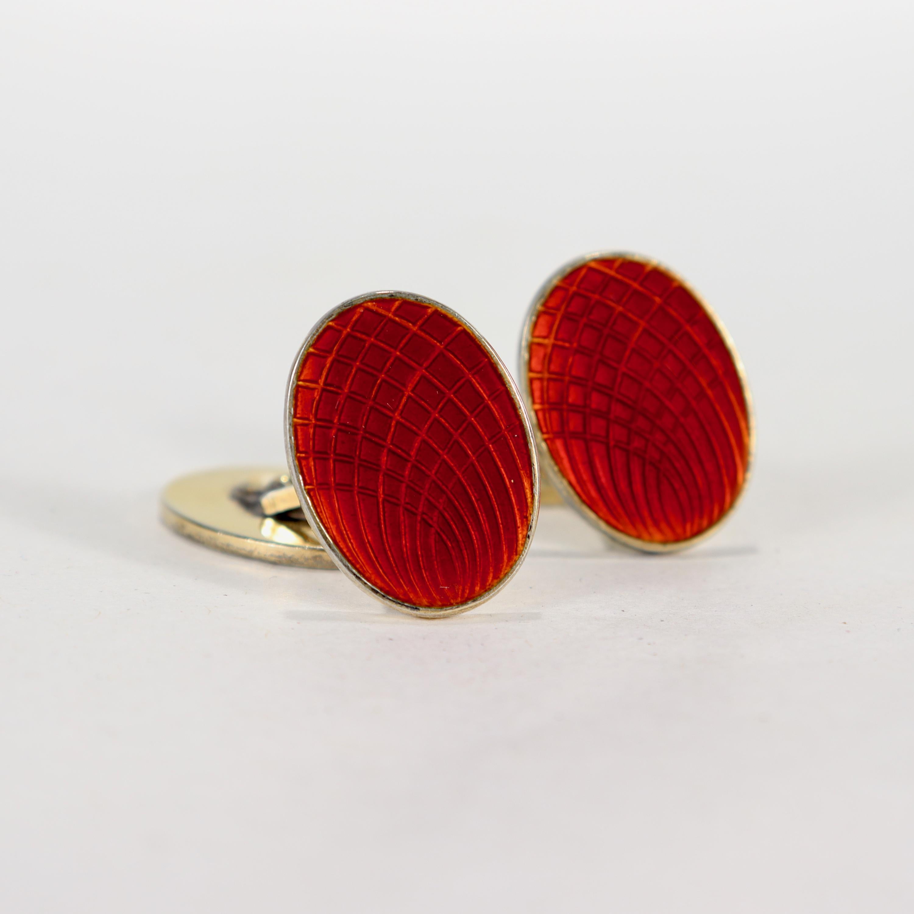 A fine pair of Norwegian cufflinks.

By N.M. Thune of Oslo, Norway.

In sterling silver with a gilt finish and red guilloche enamel. 

Simply great Scandinavian Modern cufflinks!

Date:
Mid-20th Century

Overall Condition:
They are in overall good,