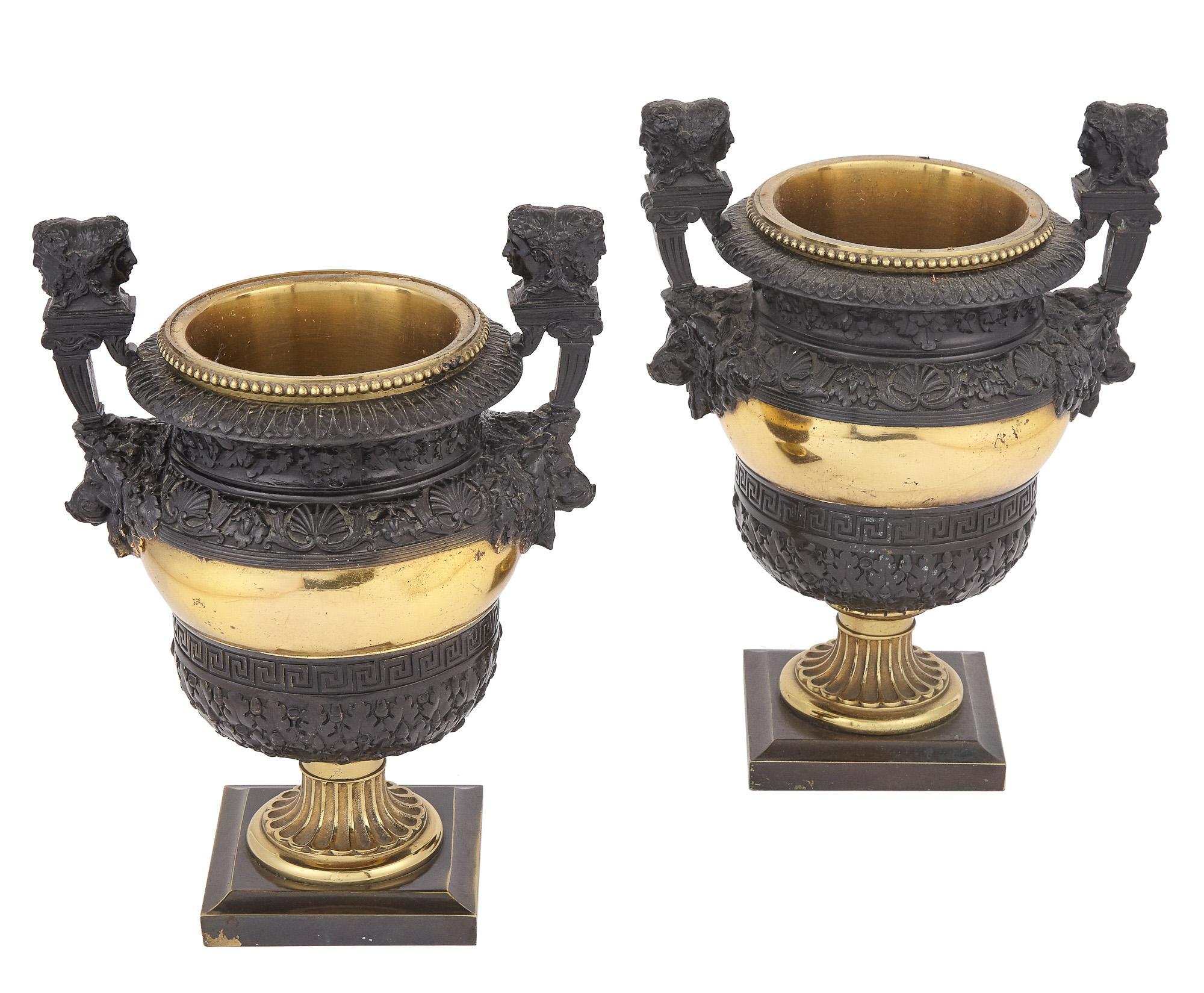 Pair of Napoleon III gilt and patinated bronze anus urns by Leopold Oudry & Cie, with preserved boxwood topiaries.
Urns 11 in tall and 8 in wide. Urns with topiaries 20.5 in tall.
 