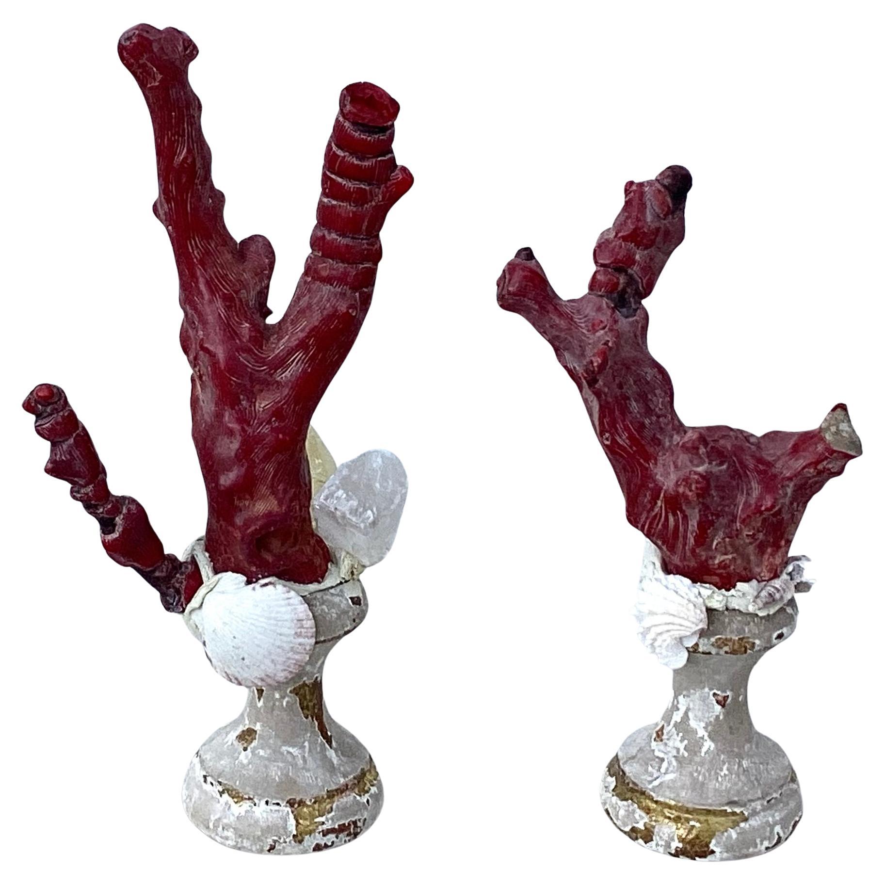 A pair of hand-crafted sculpture specimens of natural red coral branches mounted on a pair of 18th century wooden painted and gold gilt fragment bases. Smaller sculpture is 8.5