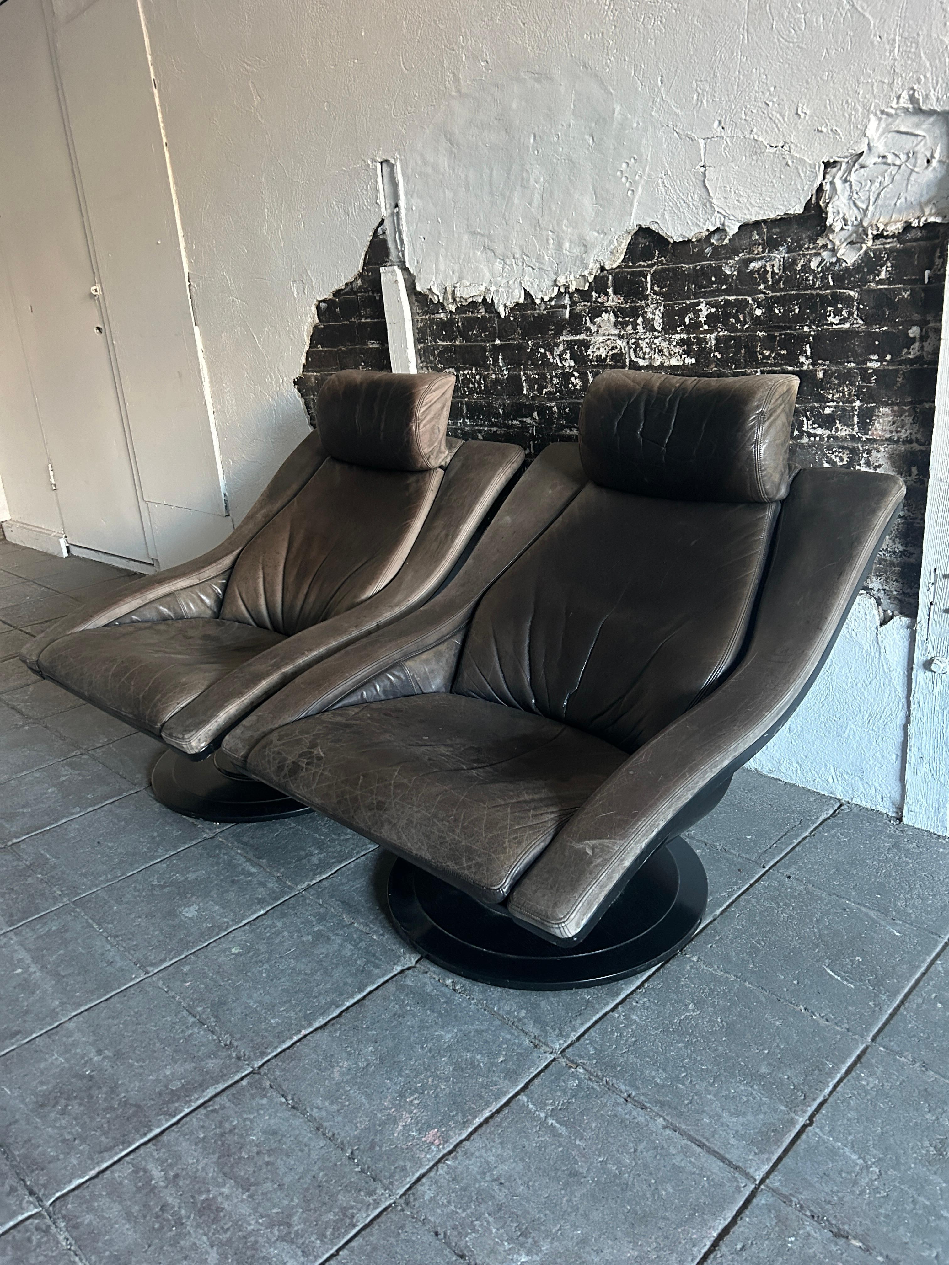 Pair of Nelo Wave Chairs by Takeshita Okamura & Erik Marquardsen for Nelo of Sweden. Gray and black patina leather chairs with black lacquer wood frames. Good vintage condition. Great design and comfortable. Chairs do swivel. Made in Sweden. Located