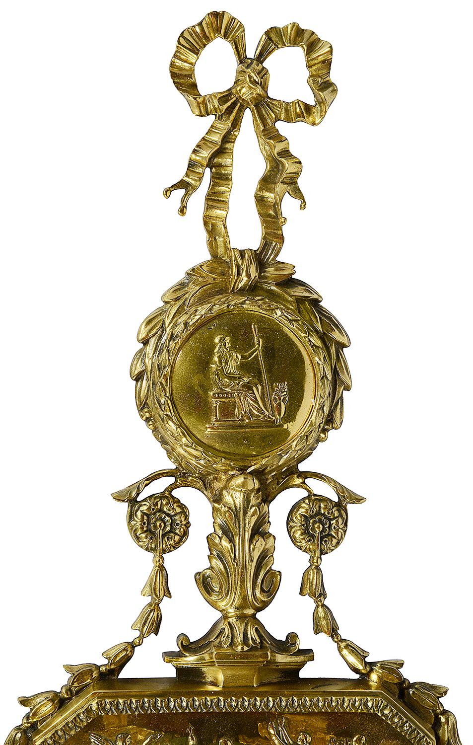 A good quality pair of late 19th century gilded ormolu neoclassical scrolling foliate four branch wall sconces, each with plaques depicting figures in council, motifs, swags and ribbon decoration. Measures: 90cm(35.5