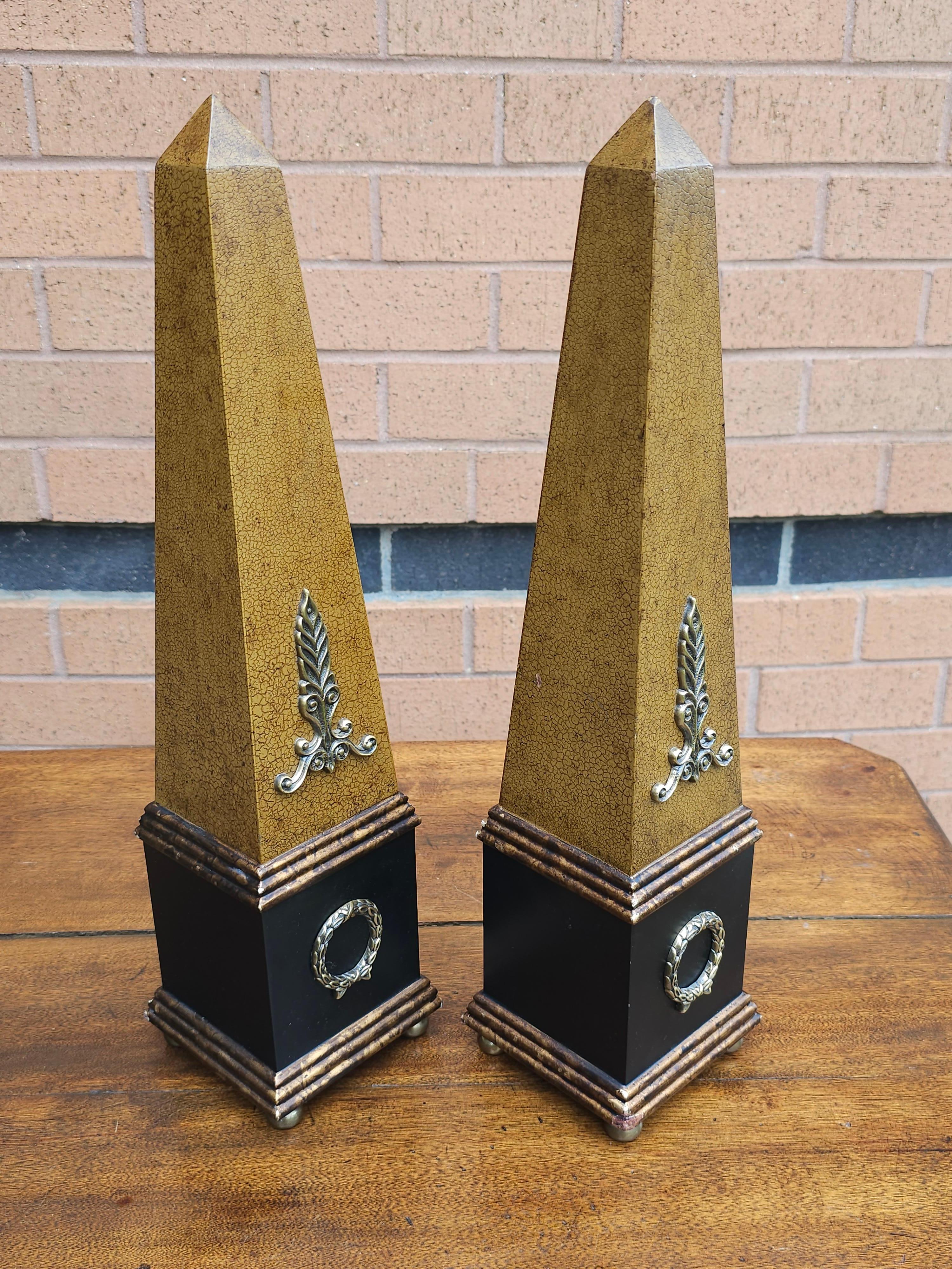 Pair Neoclassical Style Brass, Composition and Partial Ebonized and decorated Table Obelisks in great vintage condition.
Measure 4.5
