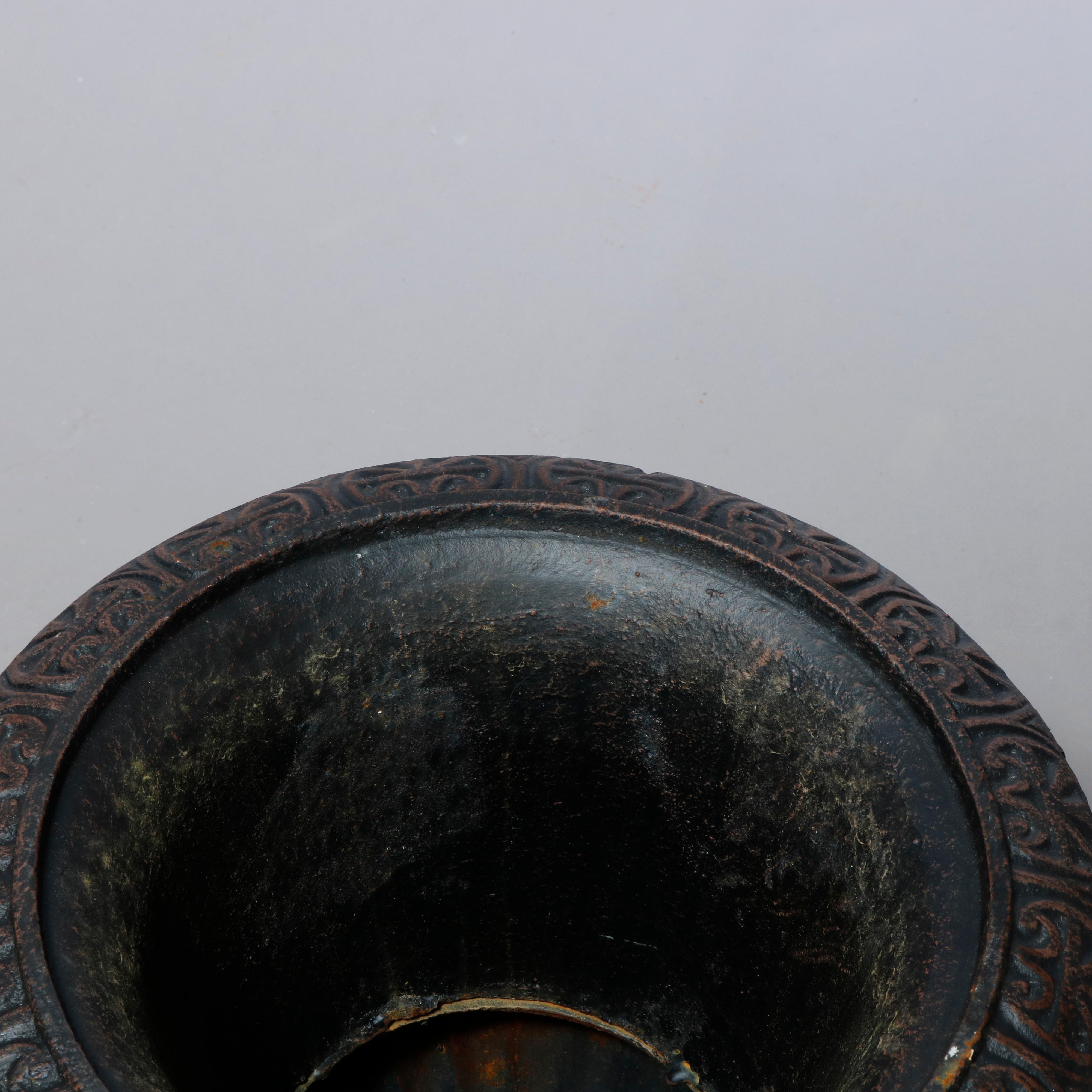A pair of neoclassical style garden urn offer cast iron construction with gadroon rim over vessel with melon base, raised on column with square base, 20th century

Measures - 26