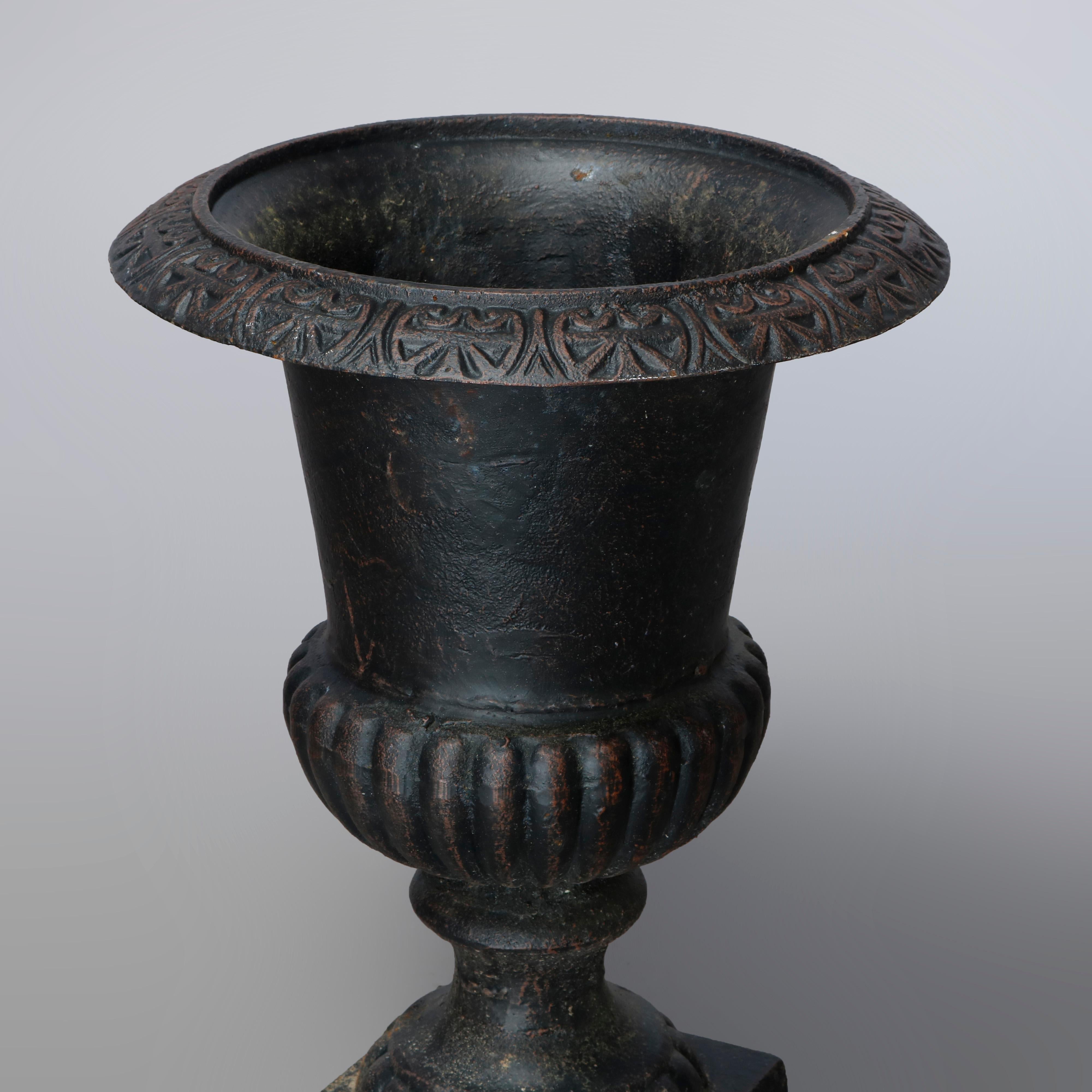 20th Century Pair of Neoclassical Style Melon Ribbed Cast Iron Garden Urns, 20th C