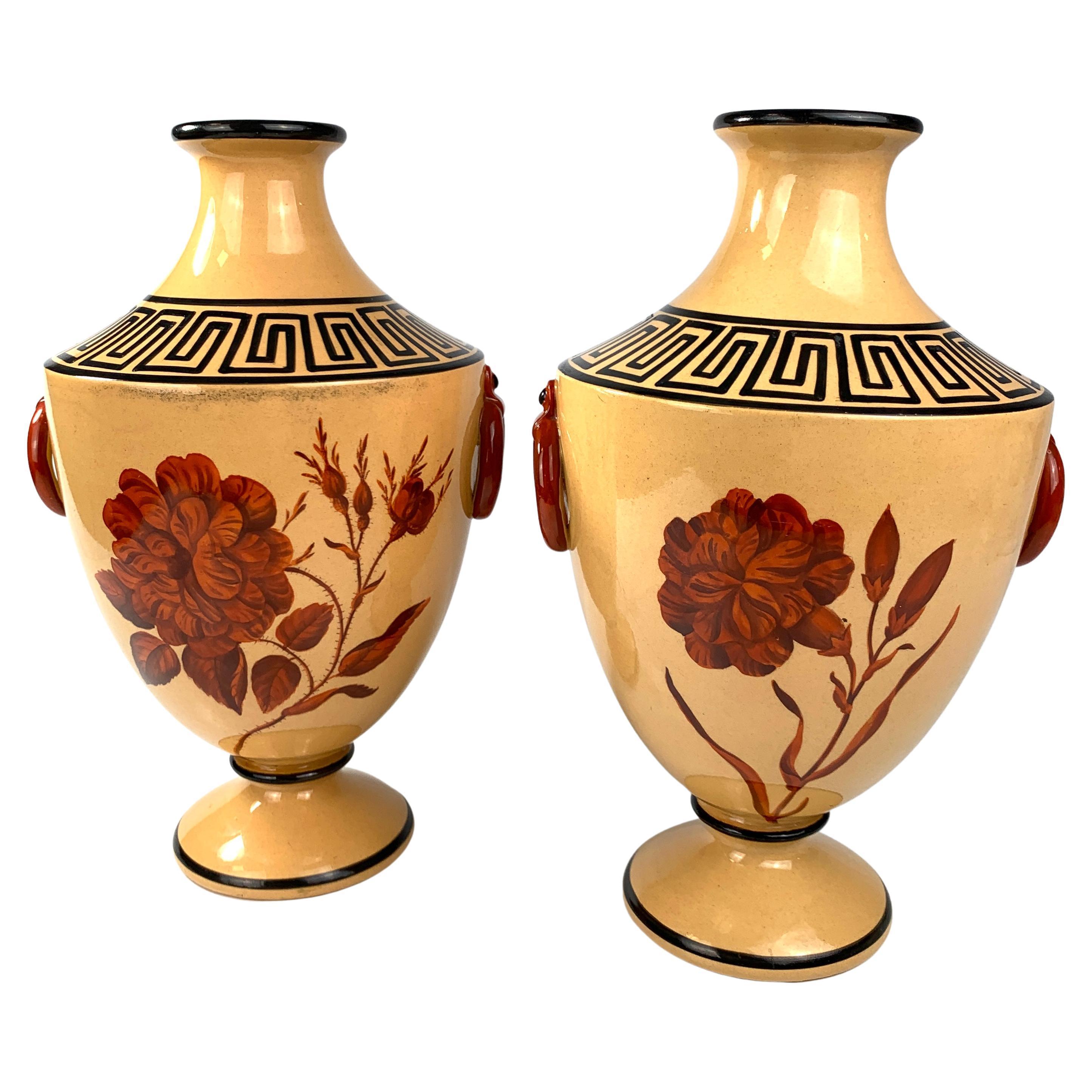This pair of neoclassical vases has exquisite, large red flowers and Greek key decoration.
This is the second time we've had this vase style, and I love this pair even more than the other earlier pair.
These outstanding vases were made by the