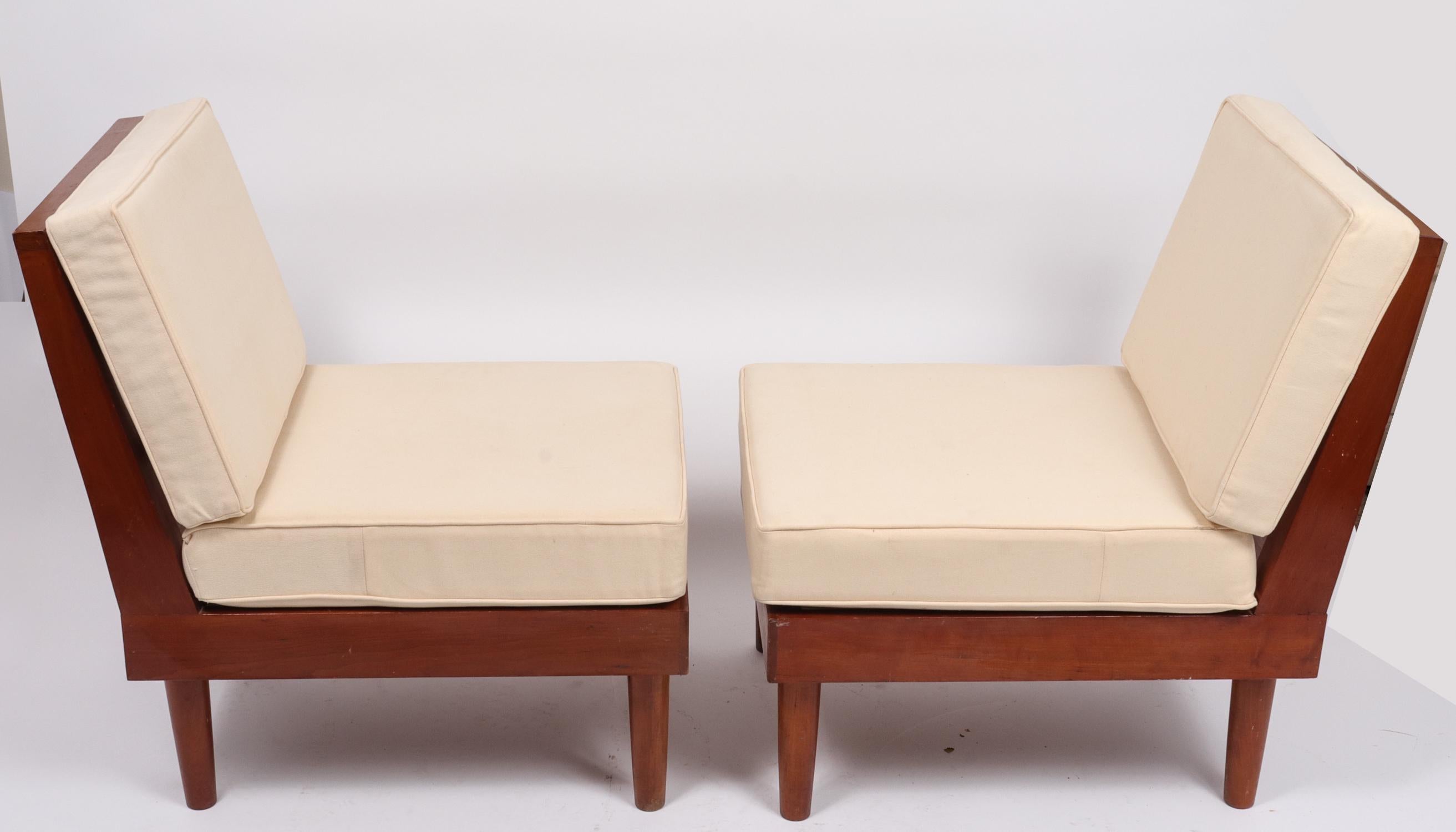 Pair of architectural New Hope style Mid-Century Modern American studio furniture lounge chairs with loose cream-color loose cushions.  Angled, ladder-backs and dowel-form legs, signed 