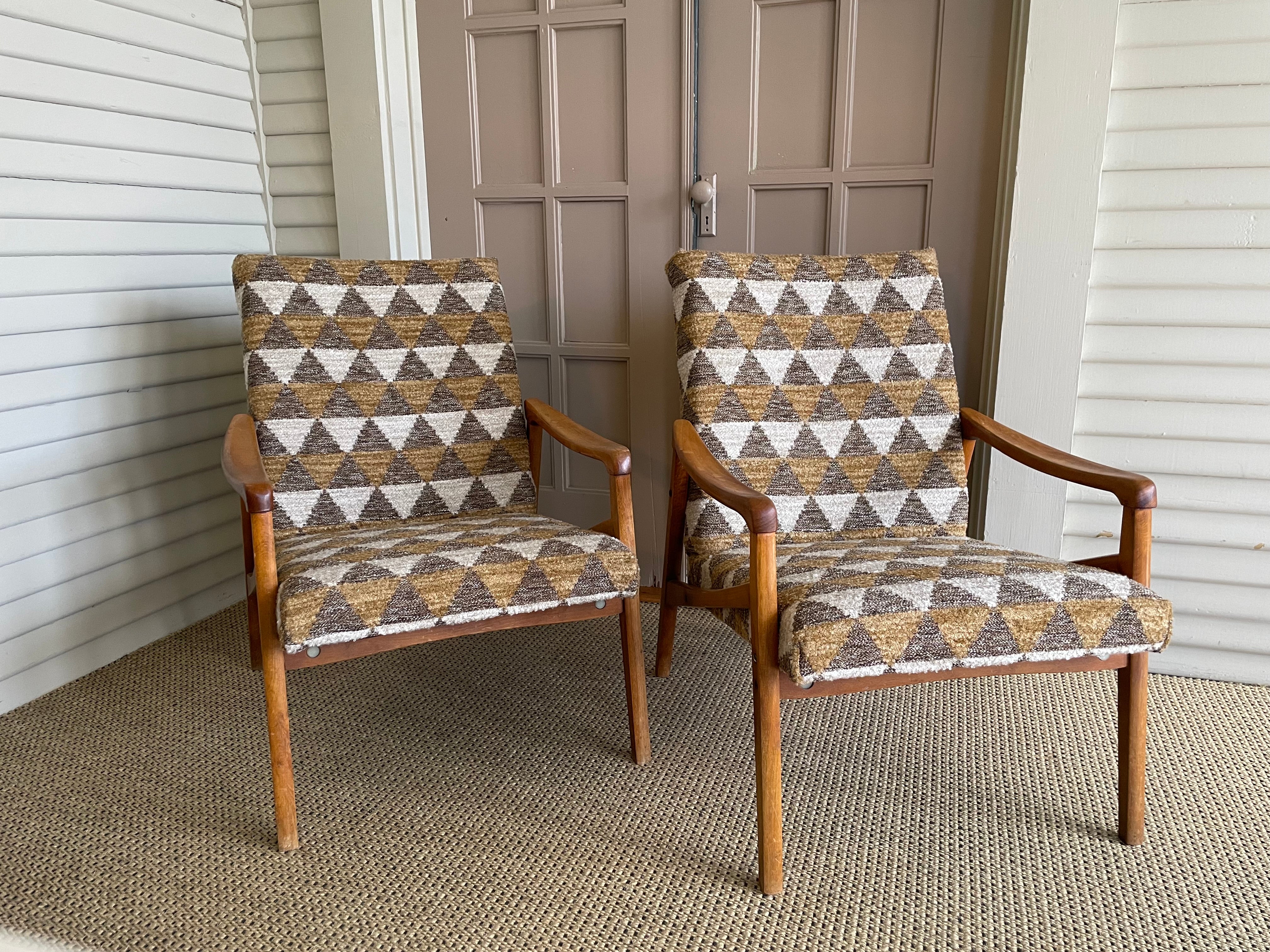 Pair newly upholstered, teak MCM chairs. 

Measures: 23
