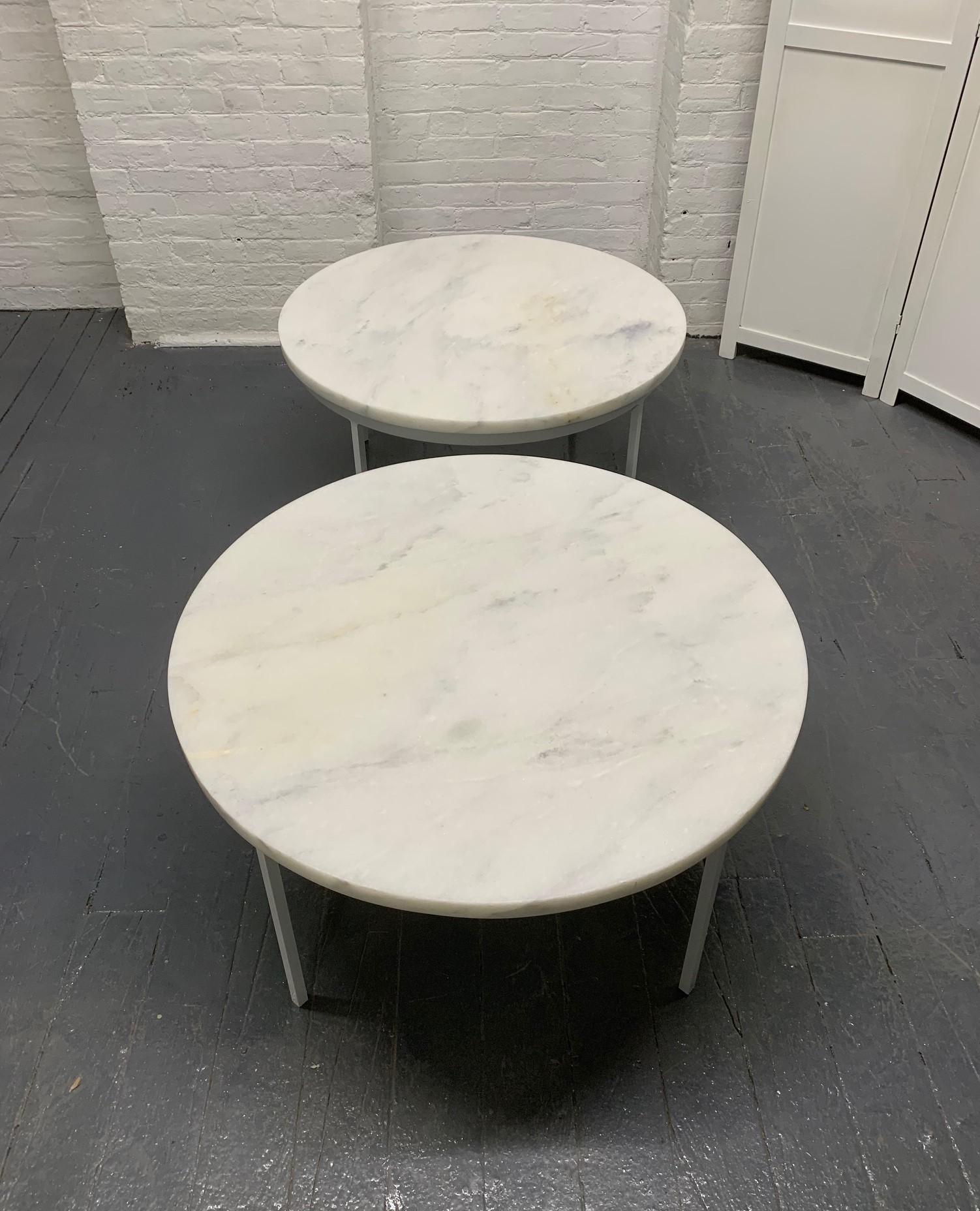 Pair of Nicos Zographos Carrara marble-top tables. The base is white painted iron with a one-inch thick Carrara marble top.