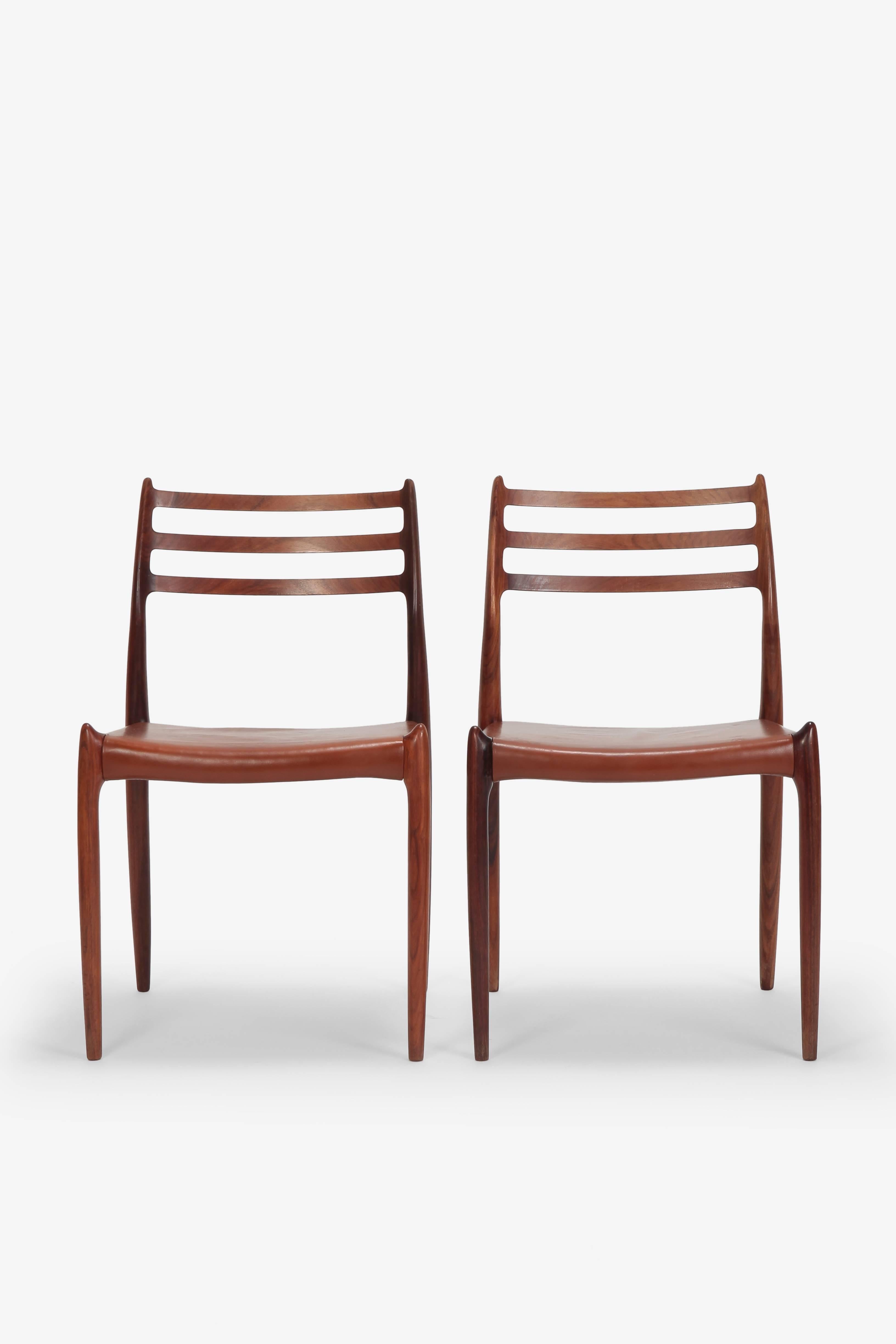 Pair of Niels Moller chairs model 78 manufactured by J.L. Moller in the 1960s. Slightly organic design structure of solid rosewood, brown leather seat covers.