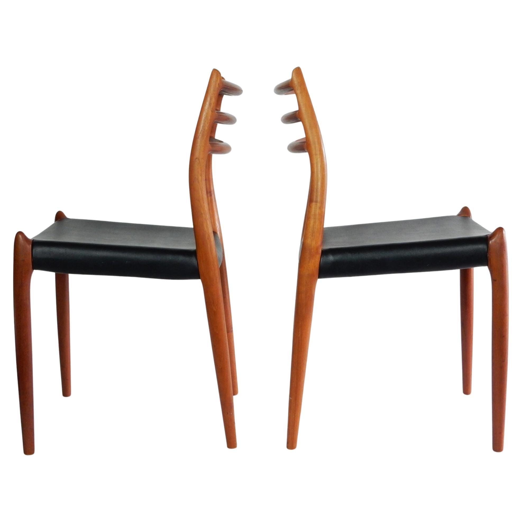 Pair Niels Otto Møller Dining Chairs Model 78 Denmark Teak & Black Leather  In Good Condition For Sale In Las Vegas, NV