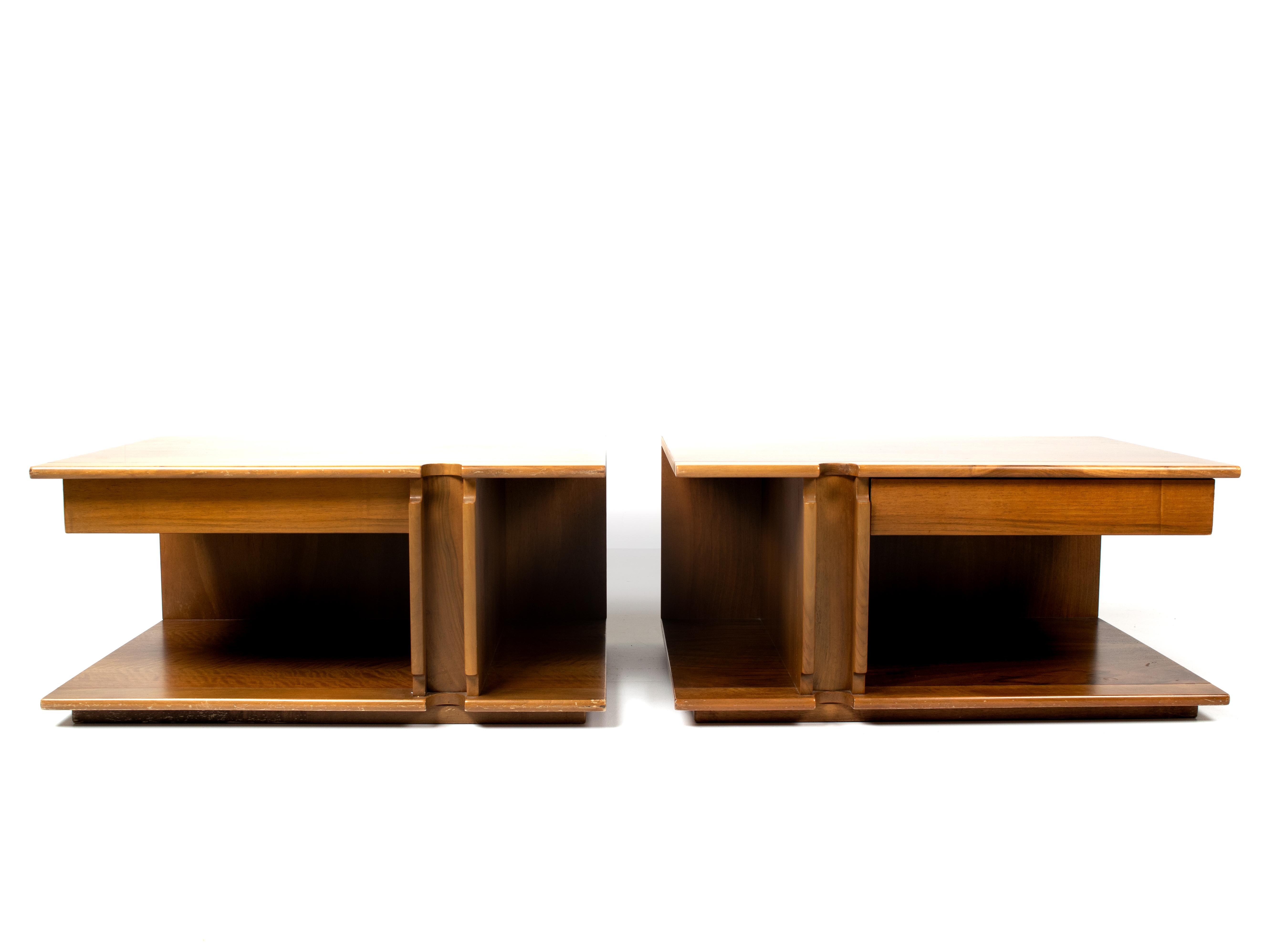 Pair of Italian modern nightstands by Franco Poli for Bernini, produced in Italy, circa 1970. The nightstands are fully made of wood and have a very nice shape that is mirrored between the two. Both have a drawer and are marked with a sticker of