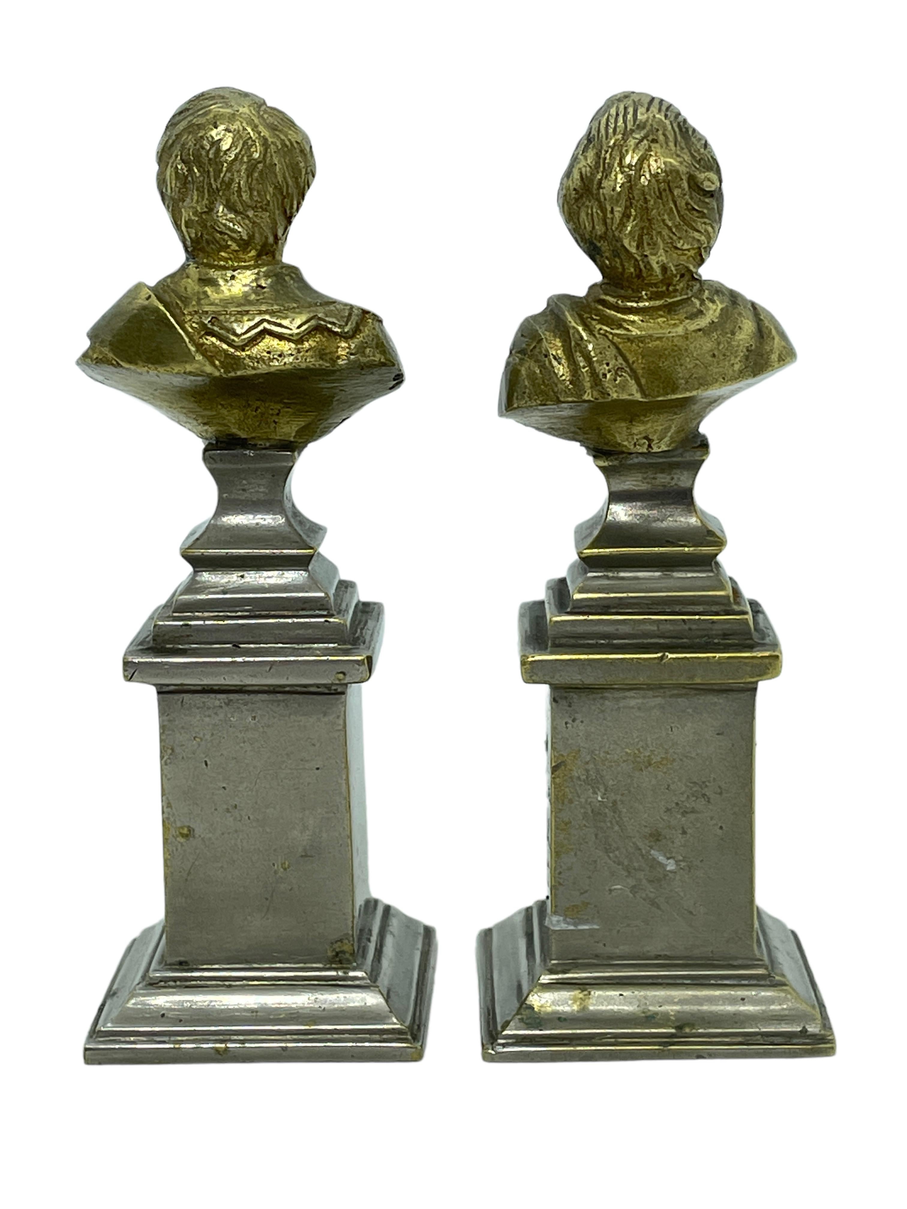 A pair of classic decorative Bust statues. Some wear with a nice patina, but this is old-age. Made of a kind of metal, we think it's brass, socket nickel plated. Very decorative and nice to display in your collection of miniatures or any room.