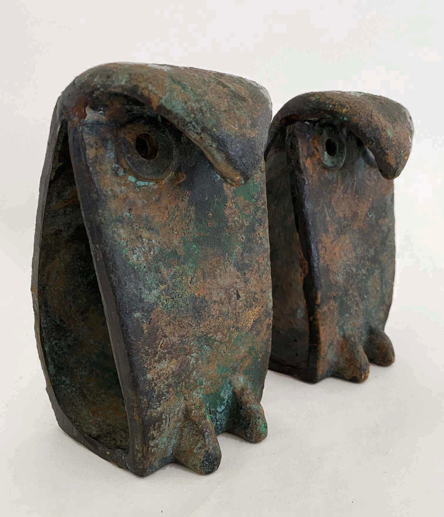 Sculptures, bookends, paperweights--you name it, these charming yet handsome iron owls have multiple uses. Made in Japan, these mid-century era figures are brutalist in style--they have a hand-wrought feel. The finish is a multi-step process which